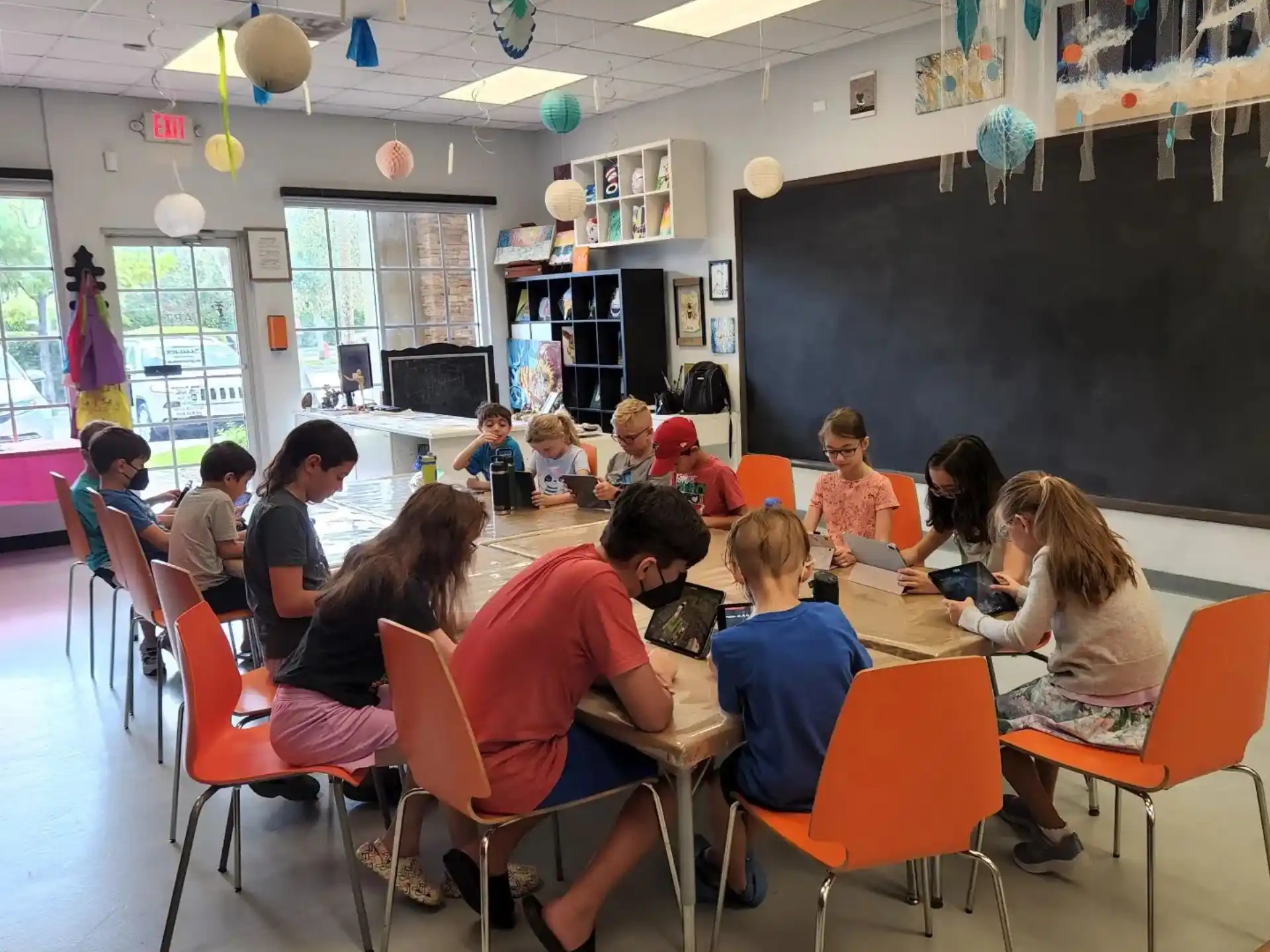 a group of people sitting in a classroom