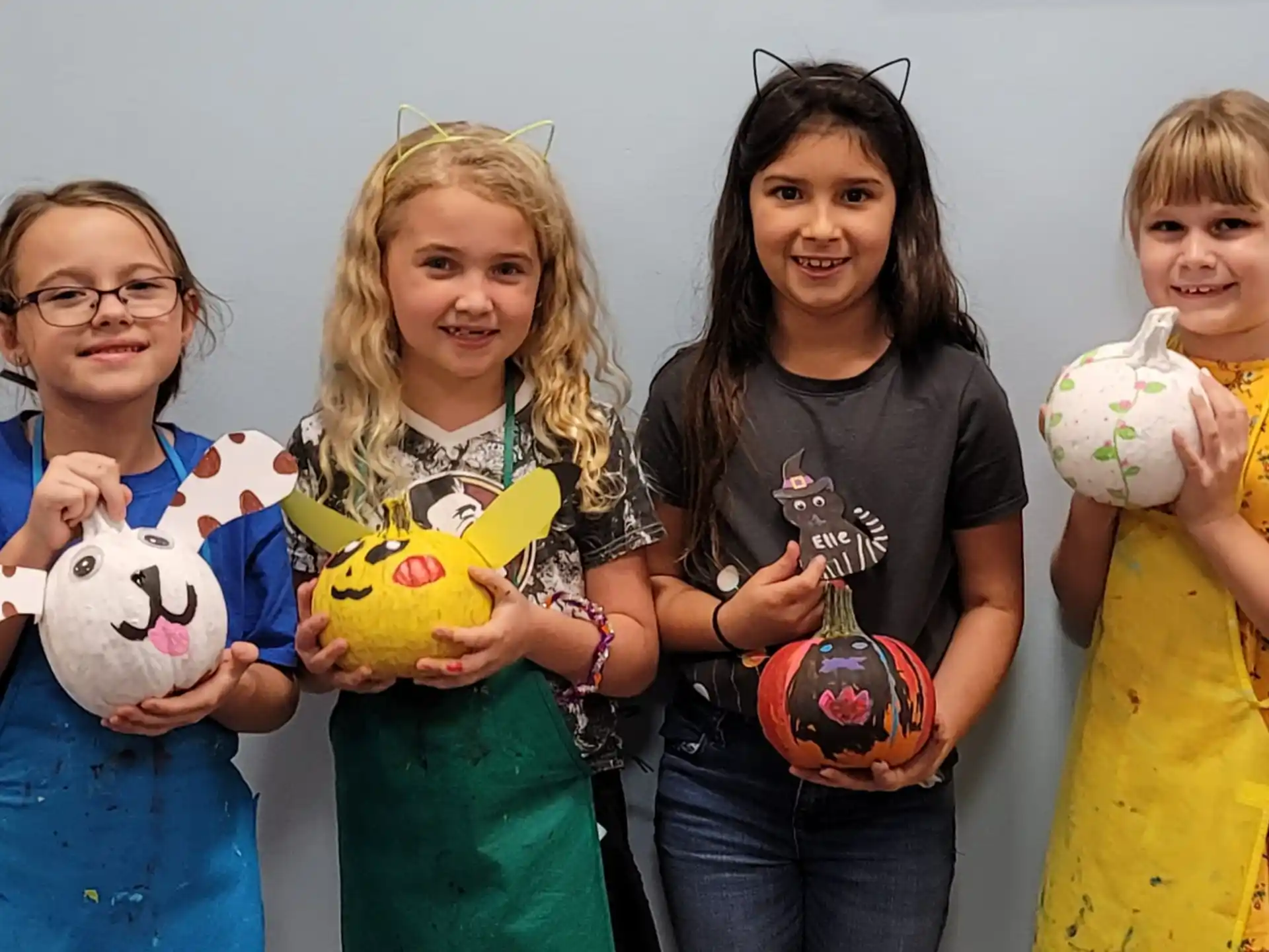 a group of girls holding toys