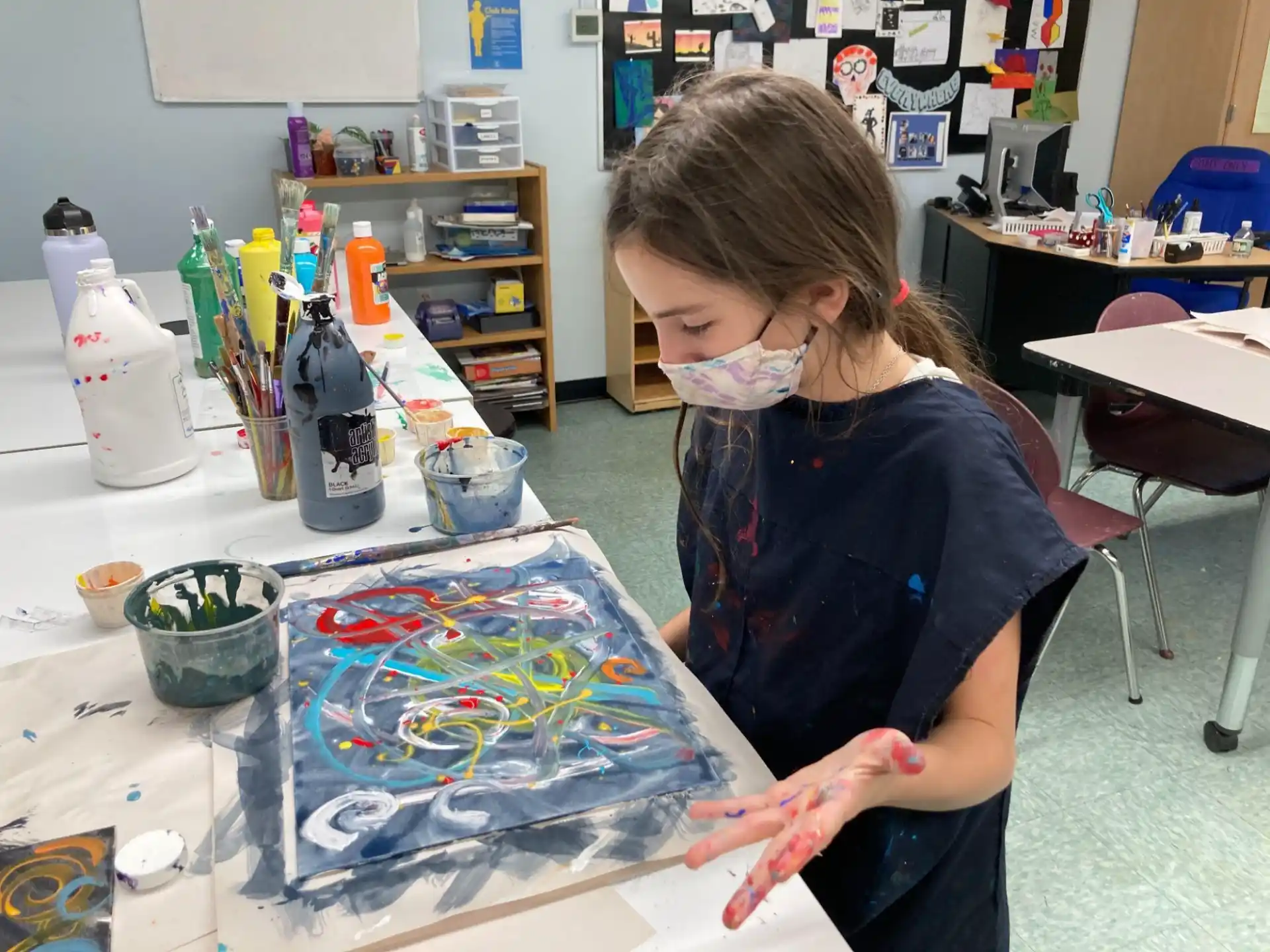 a young girl painting