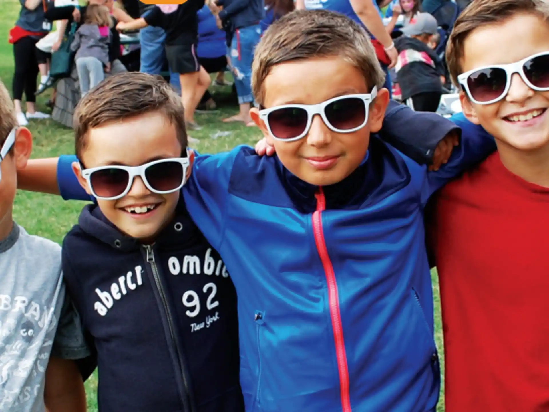 a group of boys wearing sunglasses