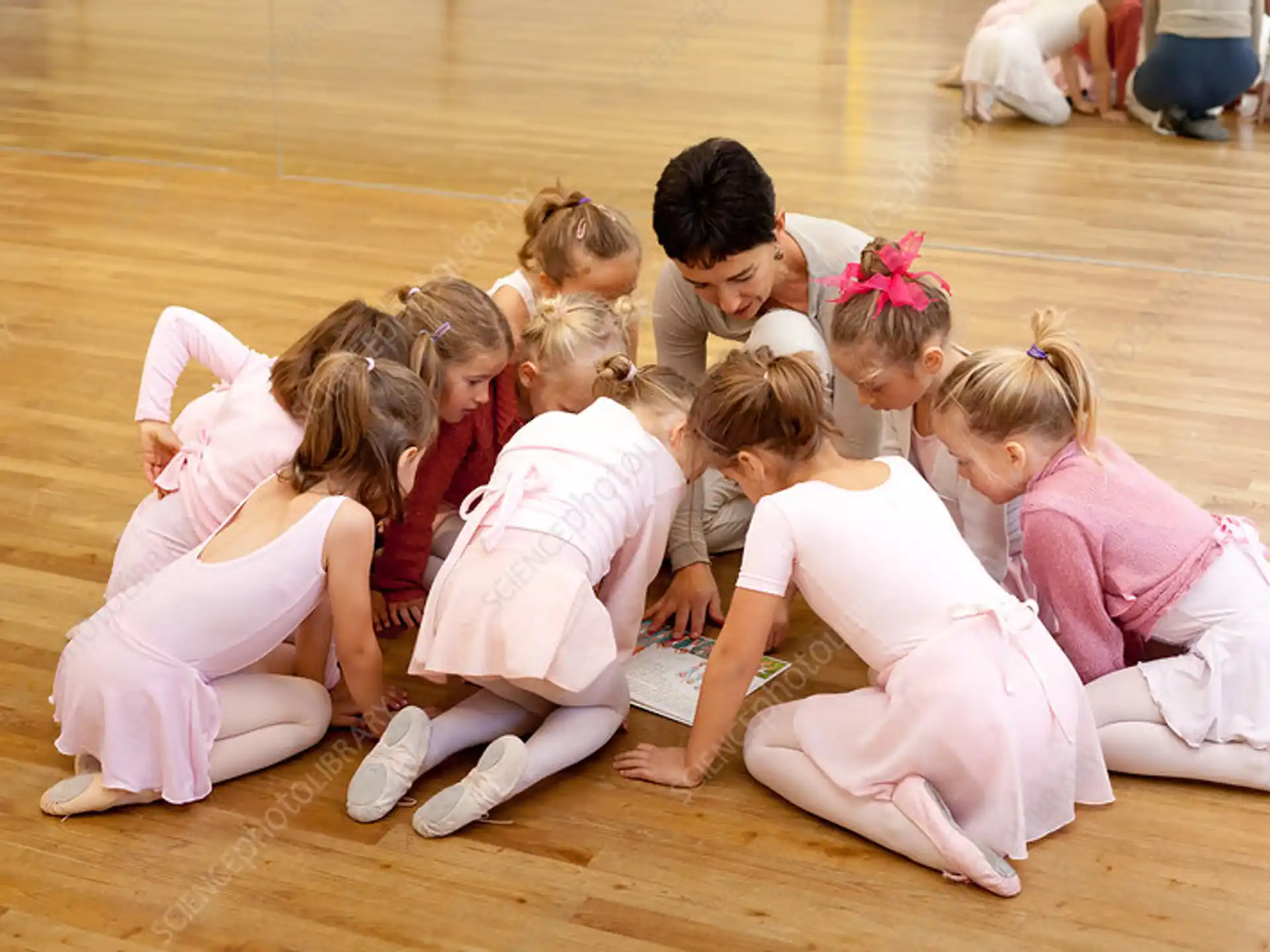 a group of children kneeling on the floor