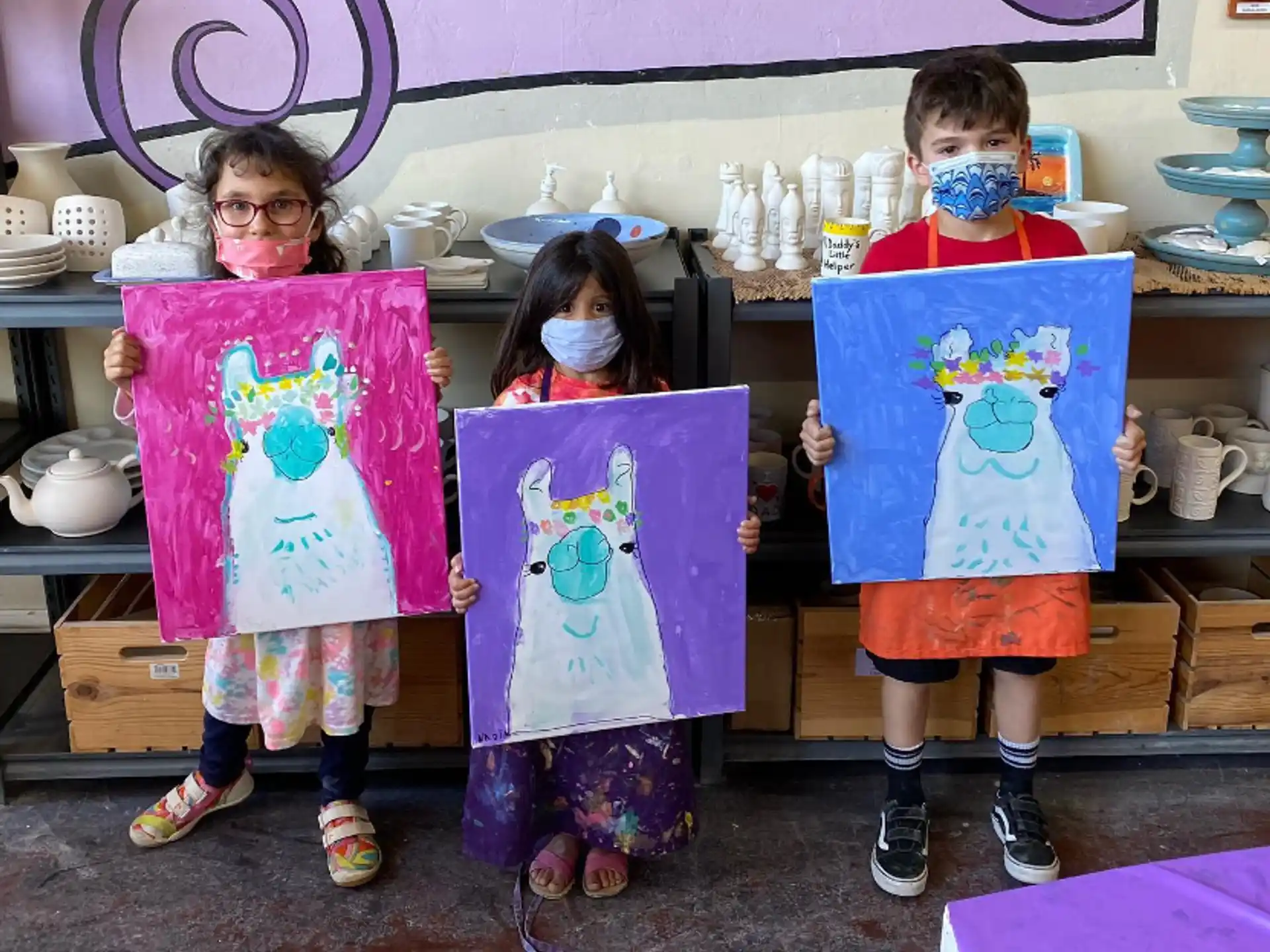 a group of children holding up posters