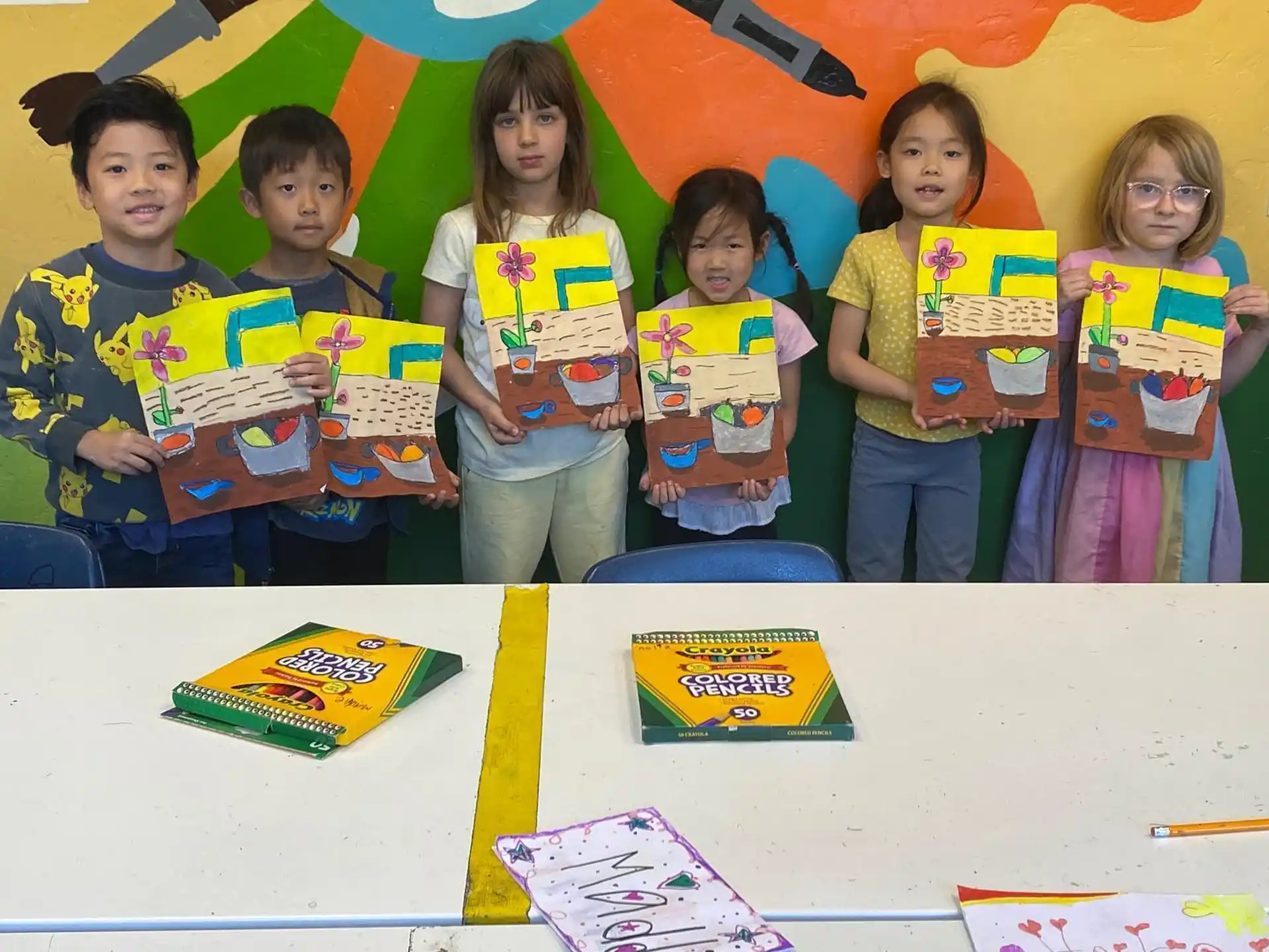 a group of children holding books