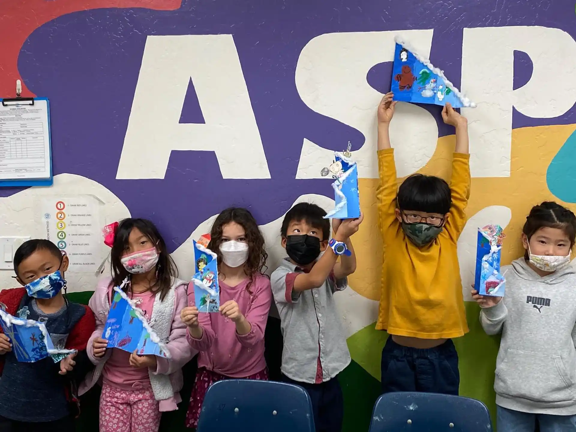 a group of children wearing masks