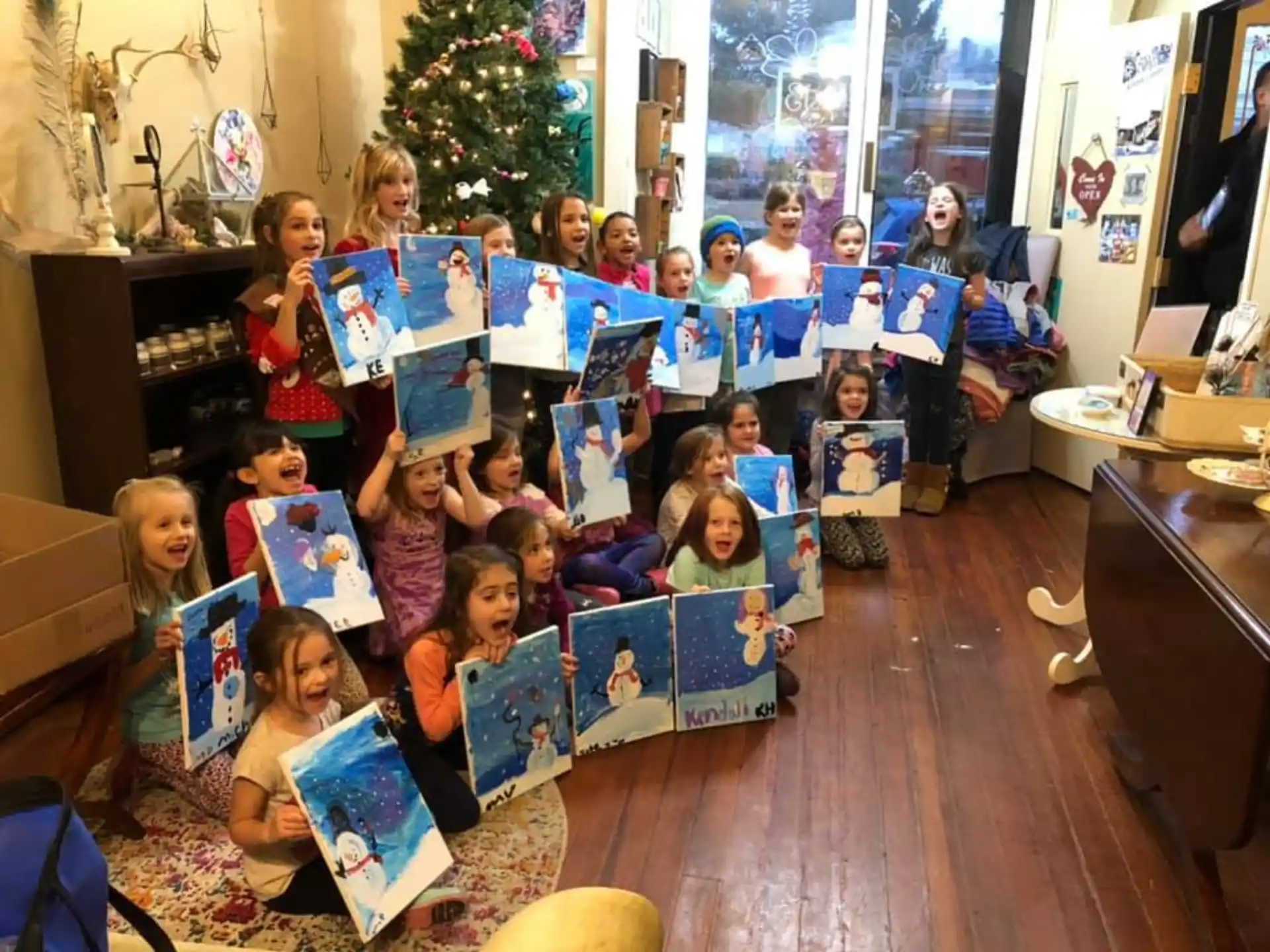 a group of children holding up books