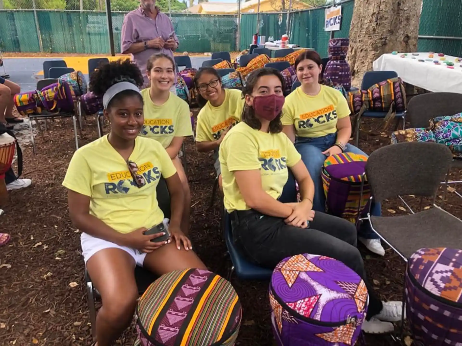 a group of women wearing yellow shirts