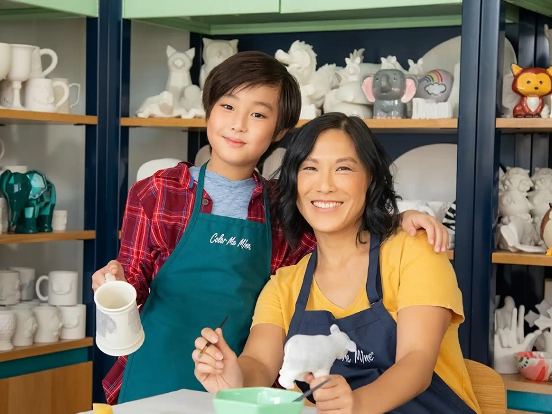 a woman and a child posing for the camera