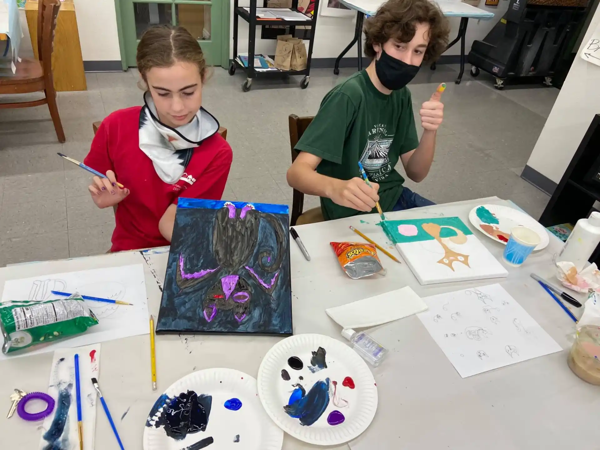 a couple of kids painting