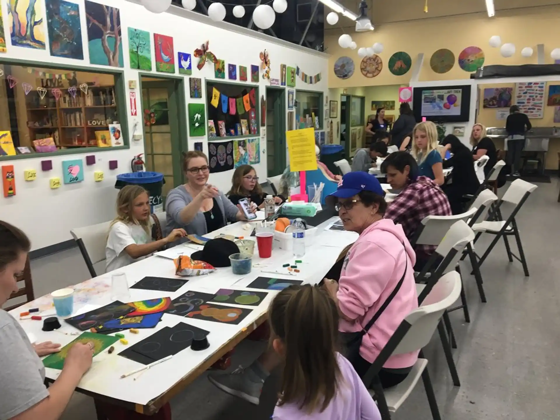 a group of people sitting at a table
