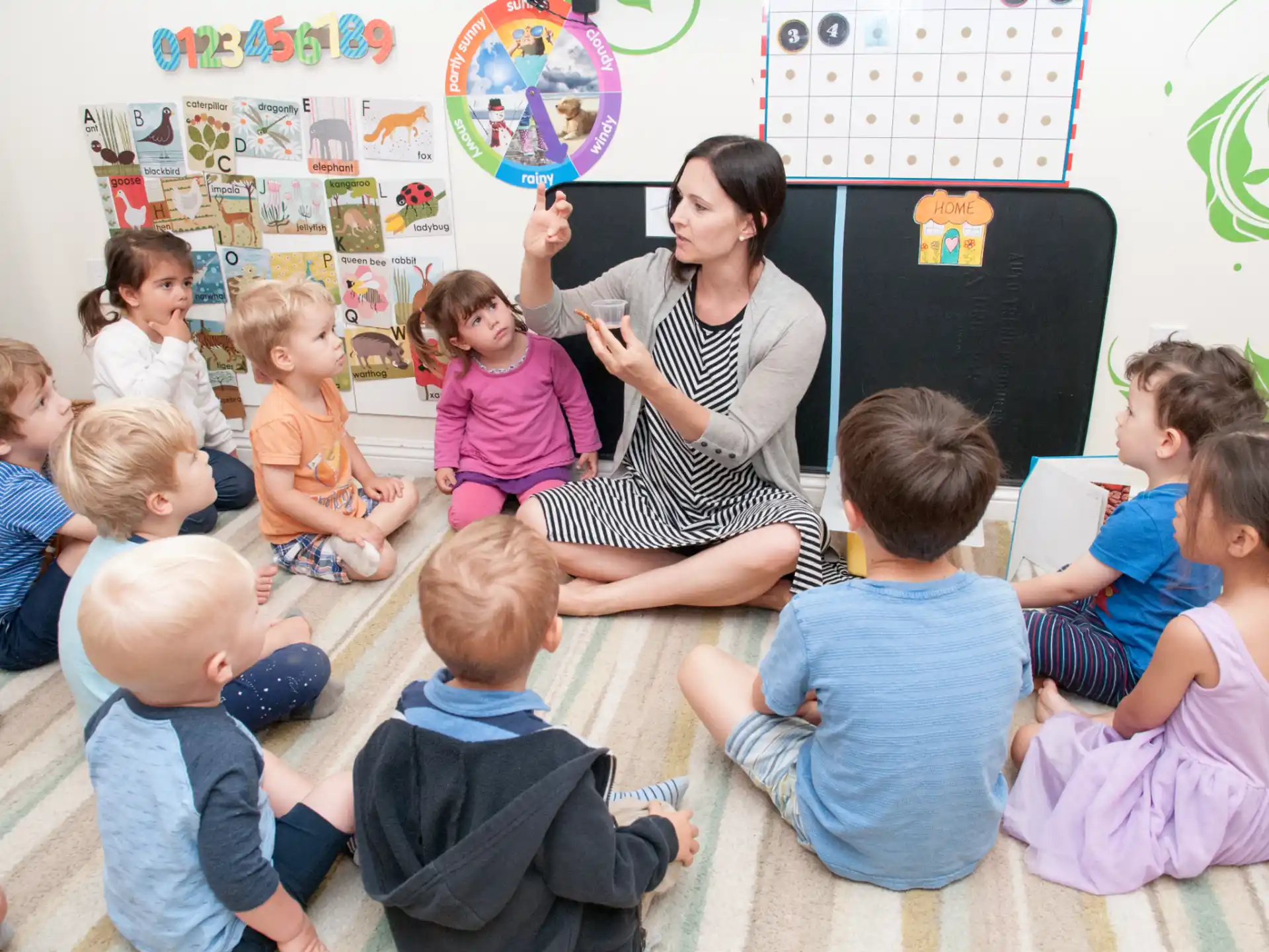 a person teaching a group of children