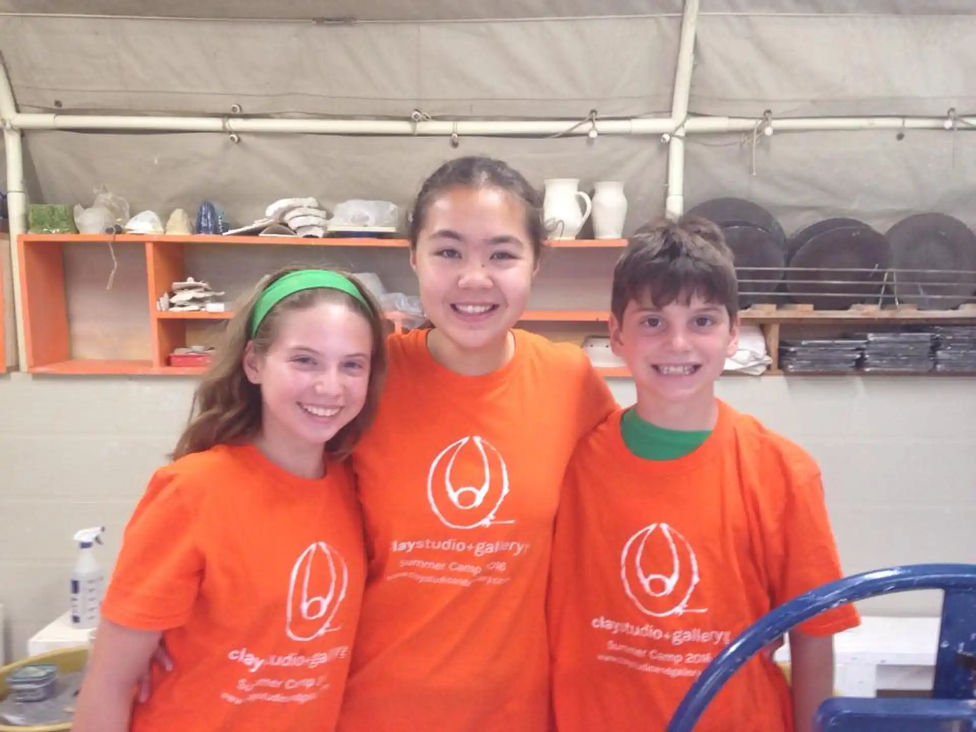 a group of people wearing orange shirts