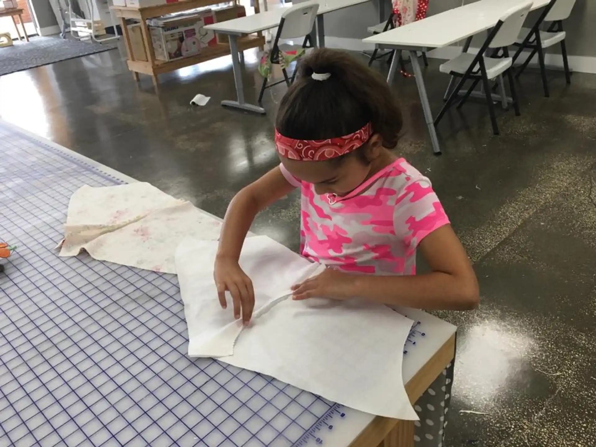 a girl sitting at a table