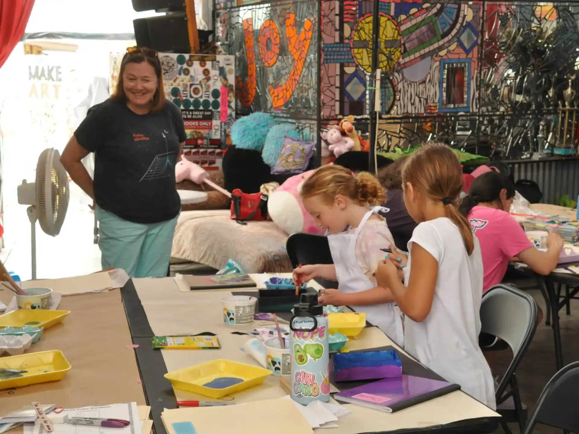 a group of children sitting at a table