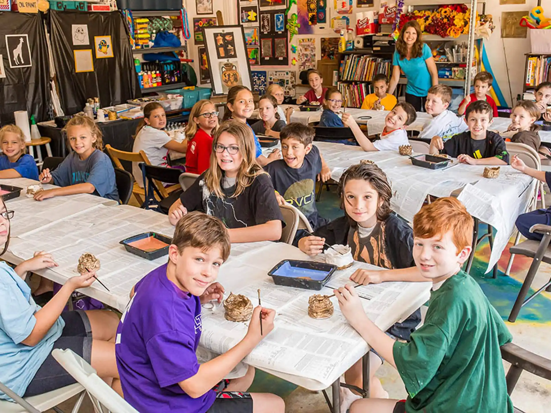a group of children sitting at tables