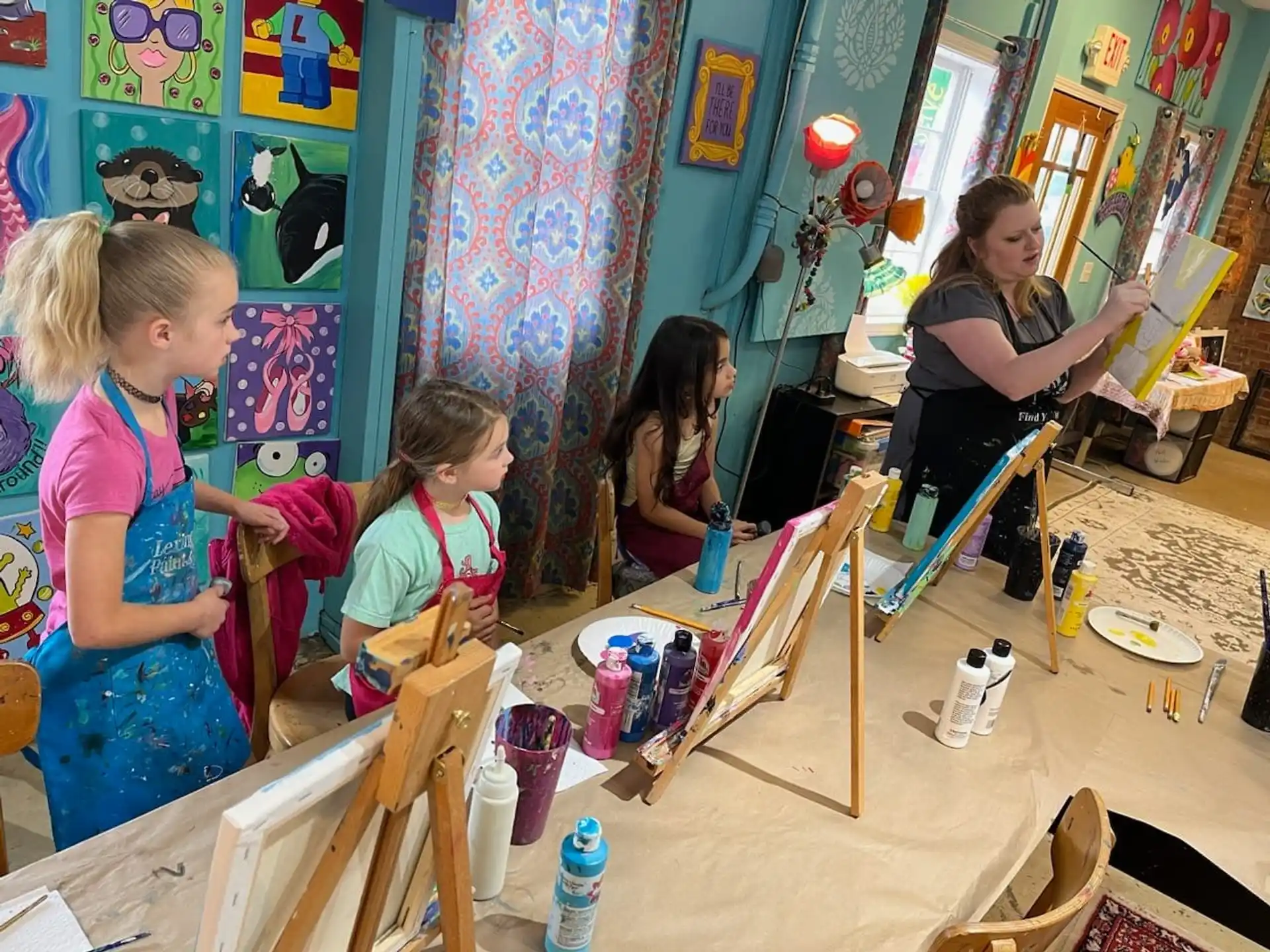 a group of children painting