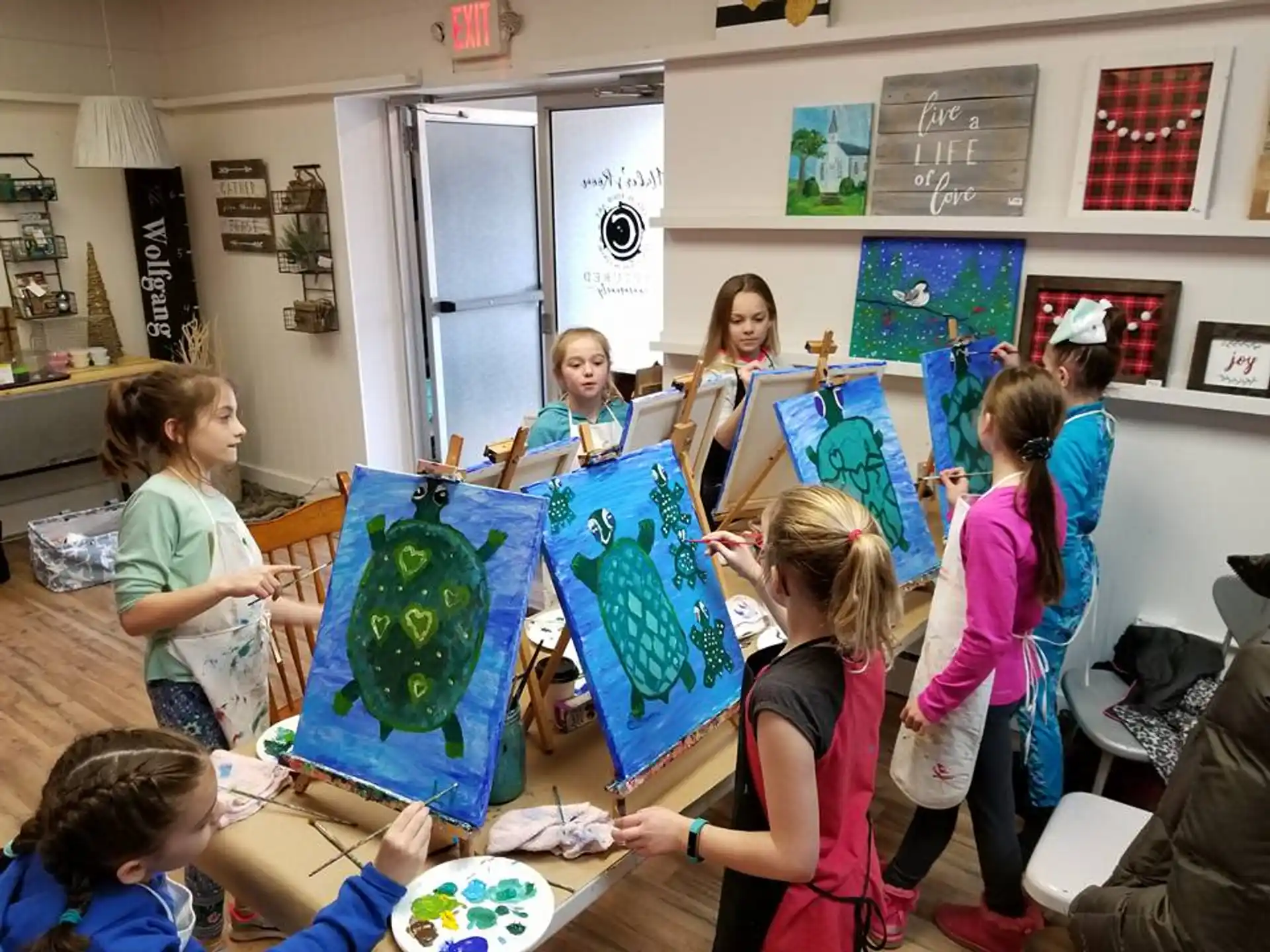 a group of children painting