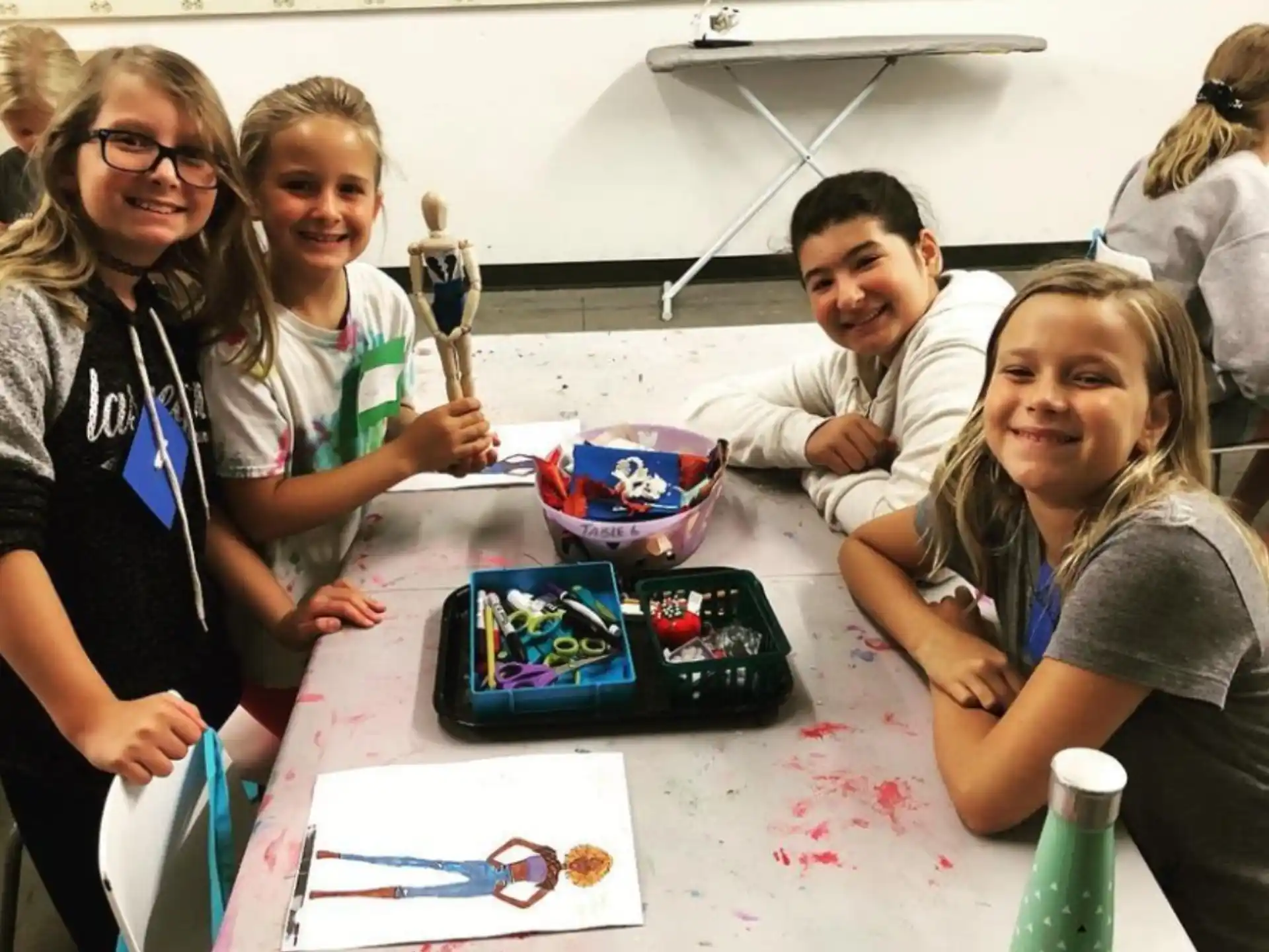 a group of people sitting at a table with a board game