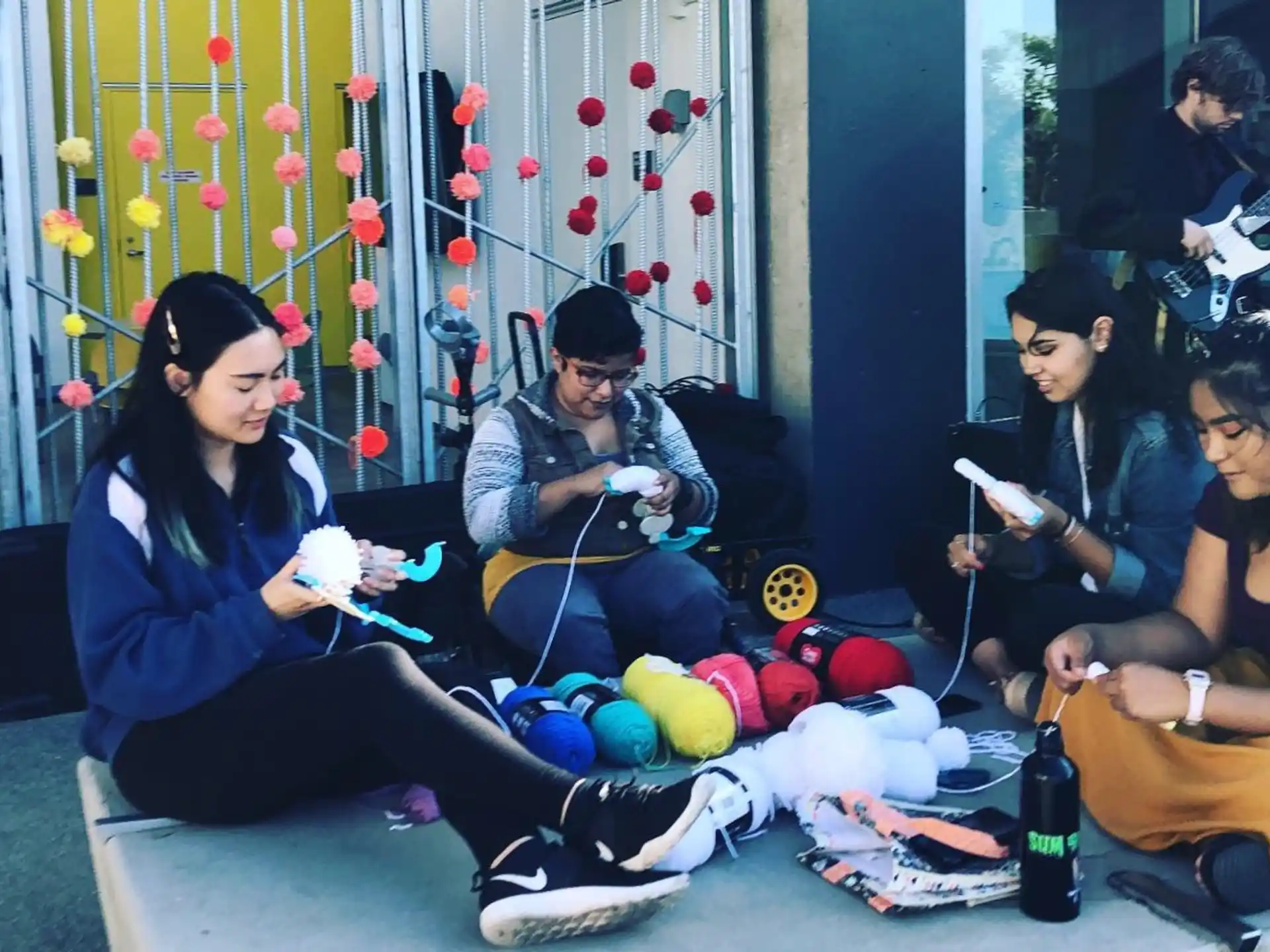 a group of people sitting on the floor