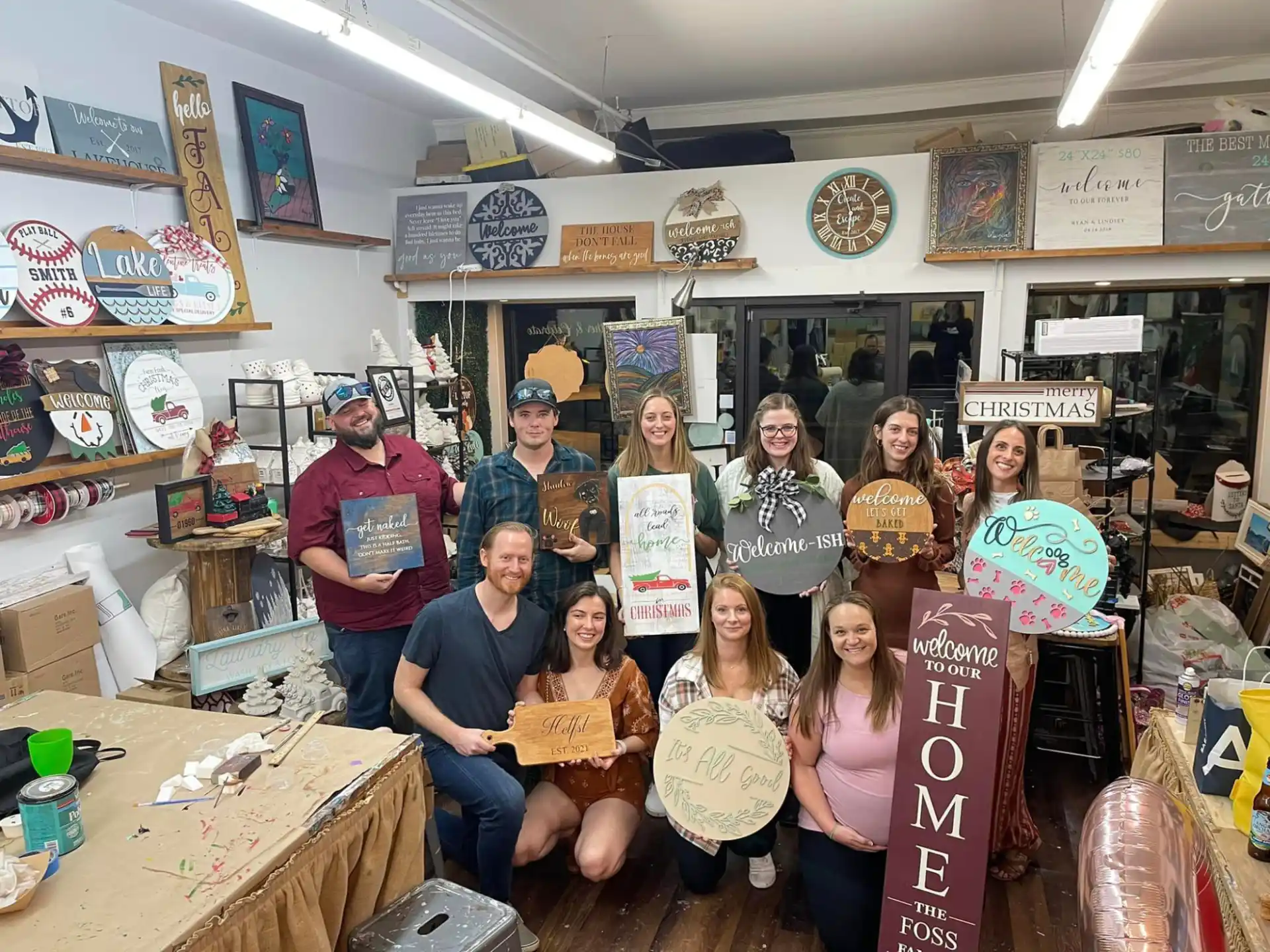 a group of people holding surfboards