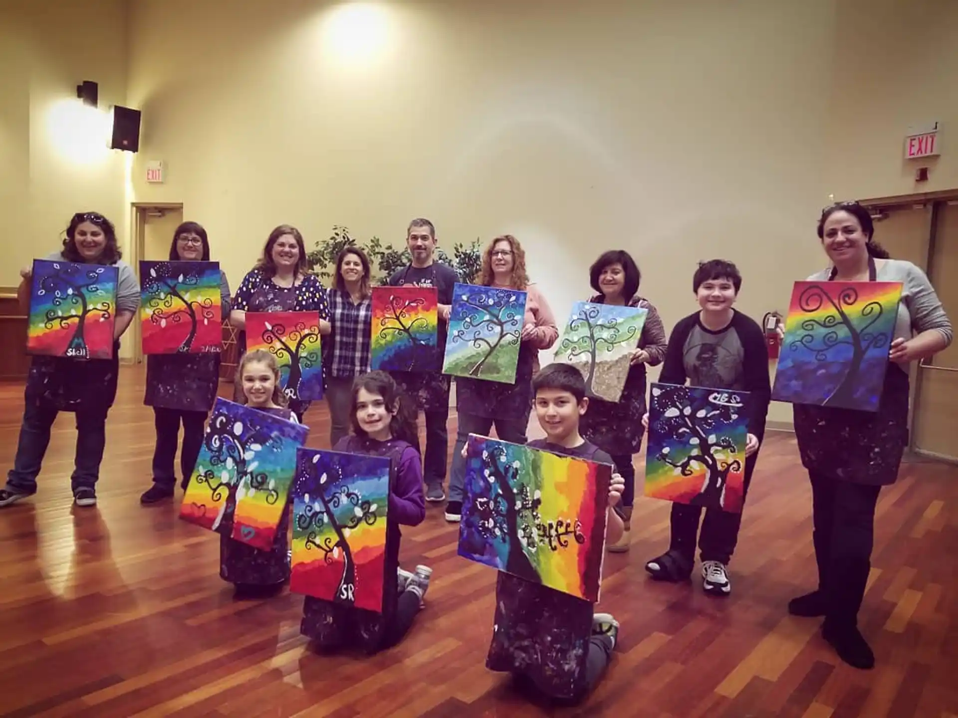 a group of children holding up colorful signs