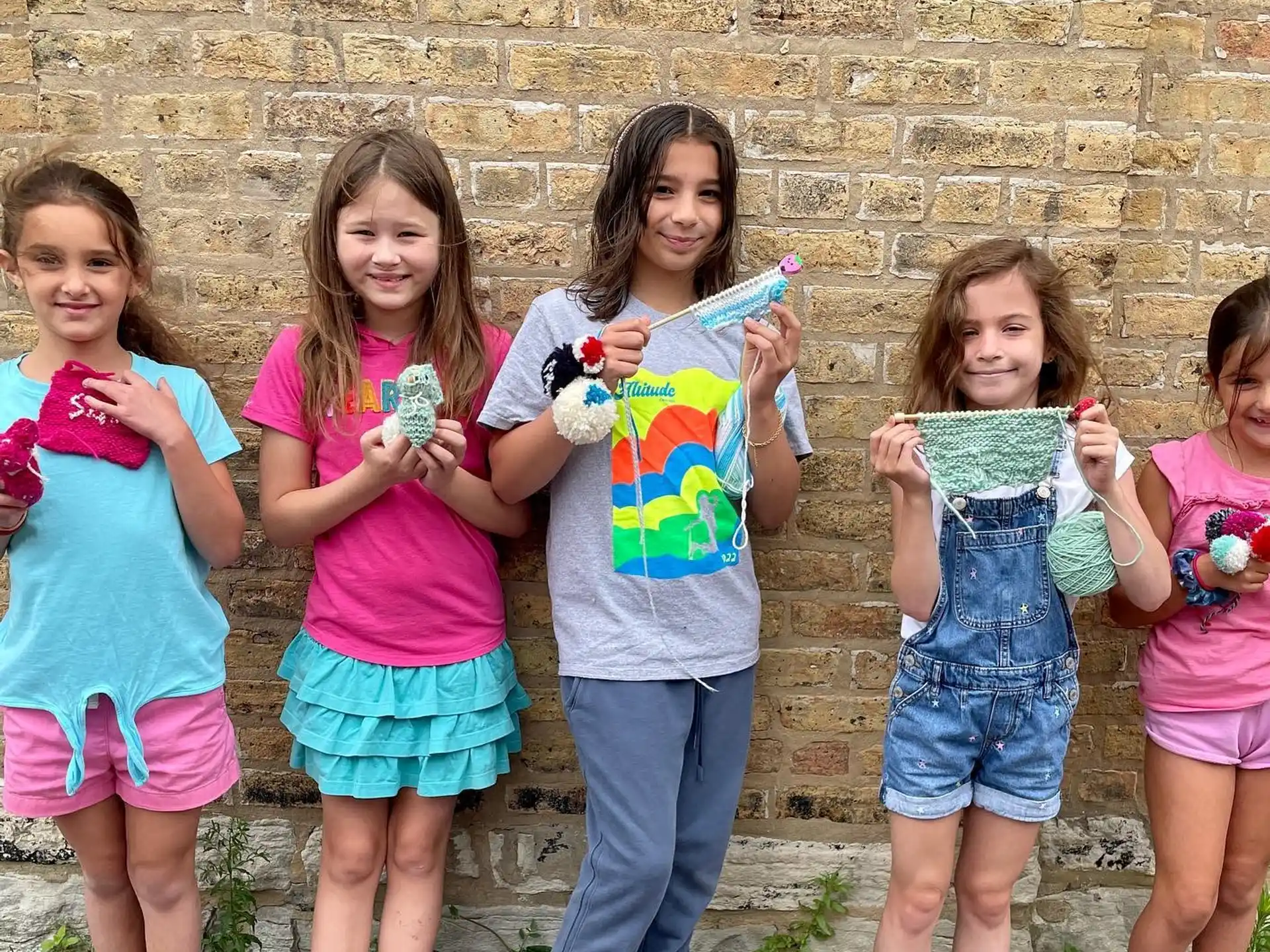 a group of girls holding ice cream cones