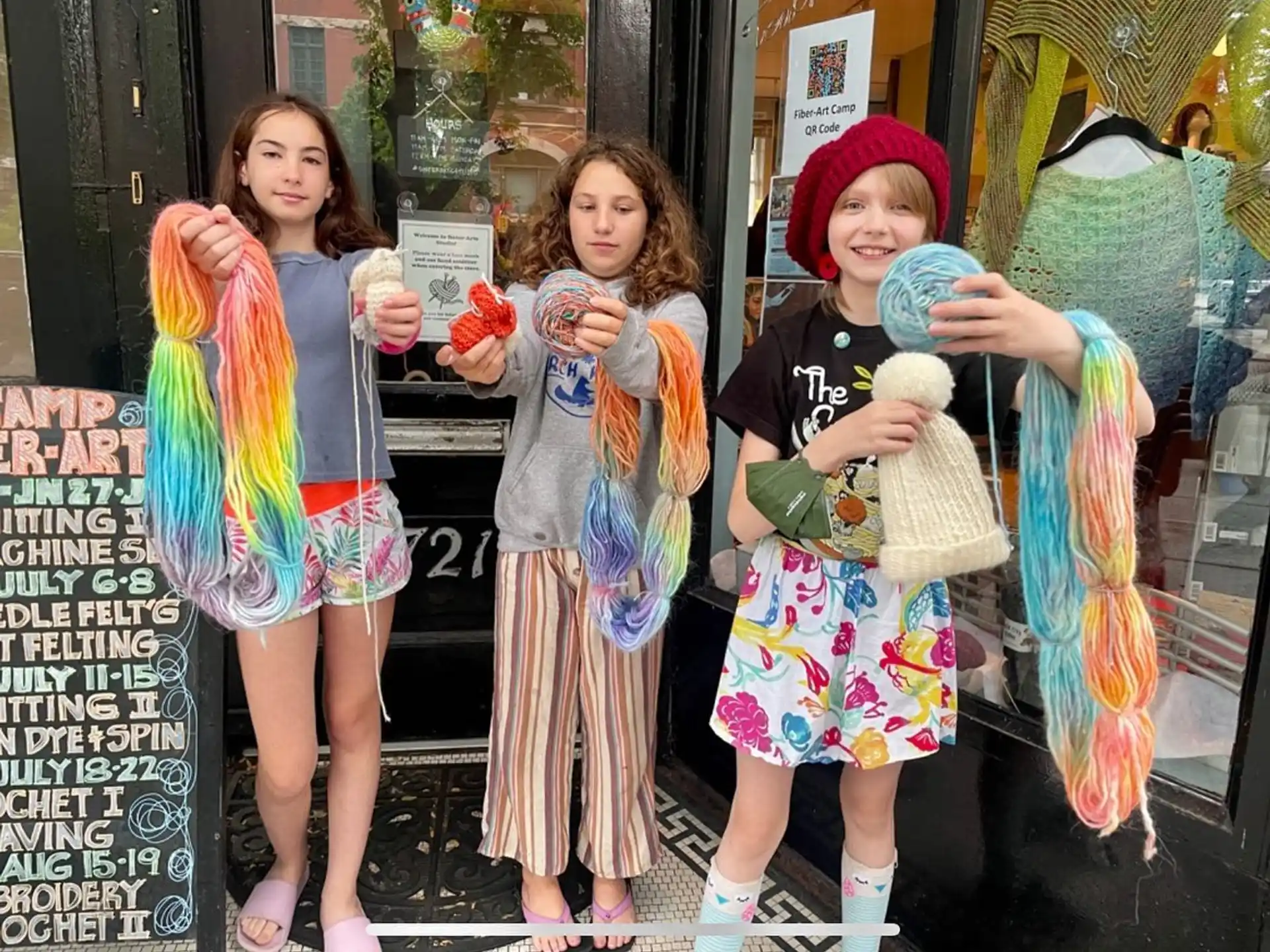 a group of girls holding stuffed animals