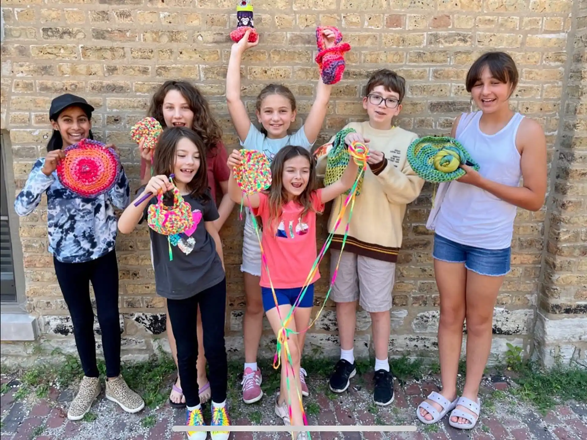 a group of kids holding toys