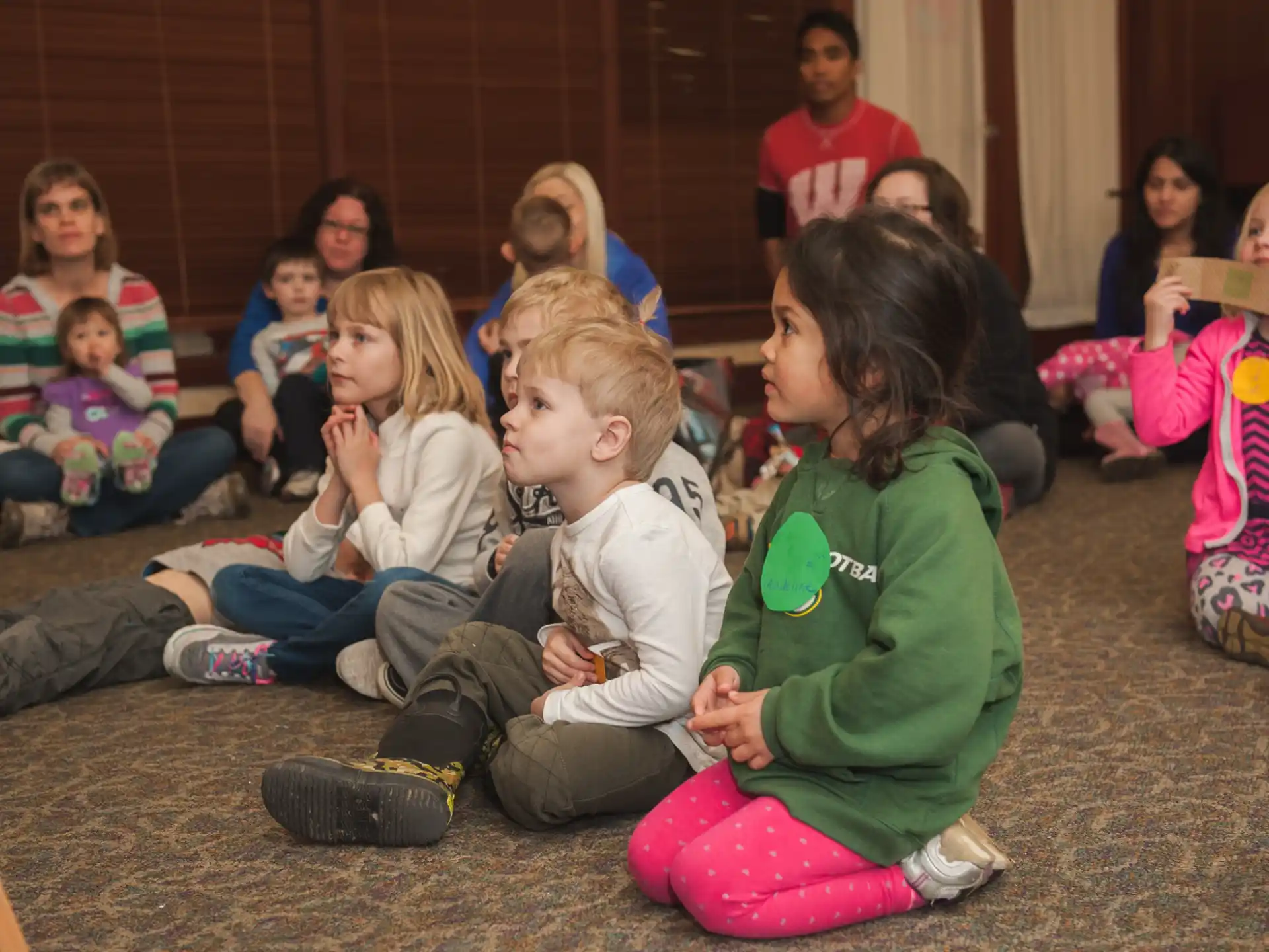 a group of children sitting on the floor