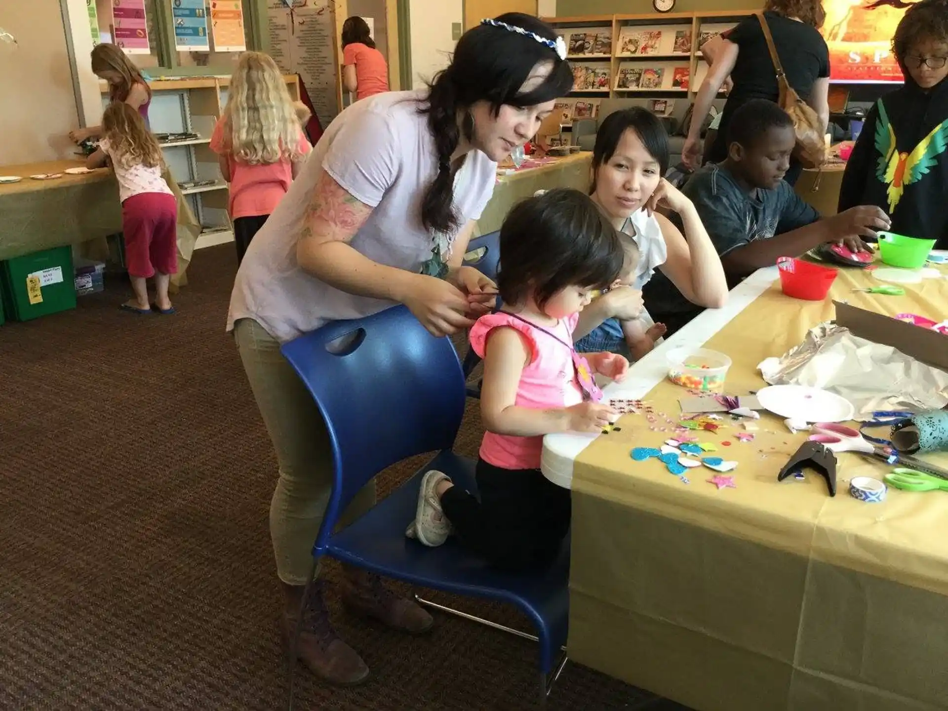 a person helping a group of children