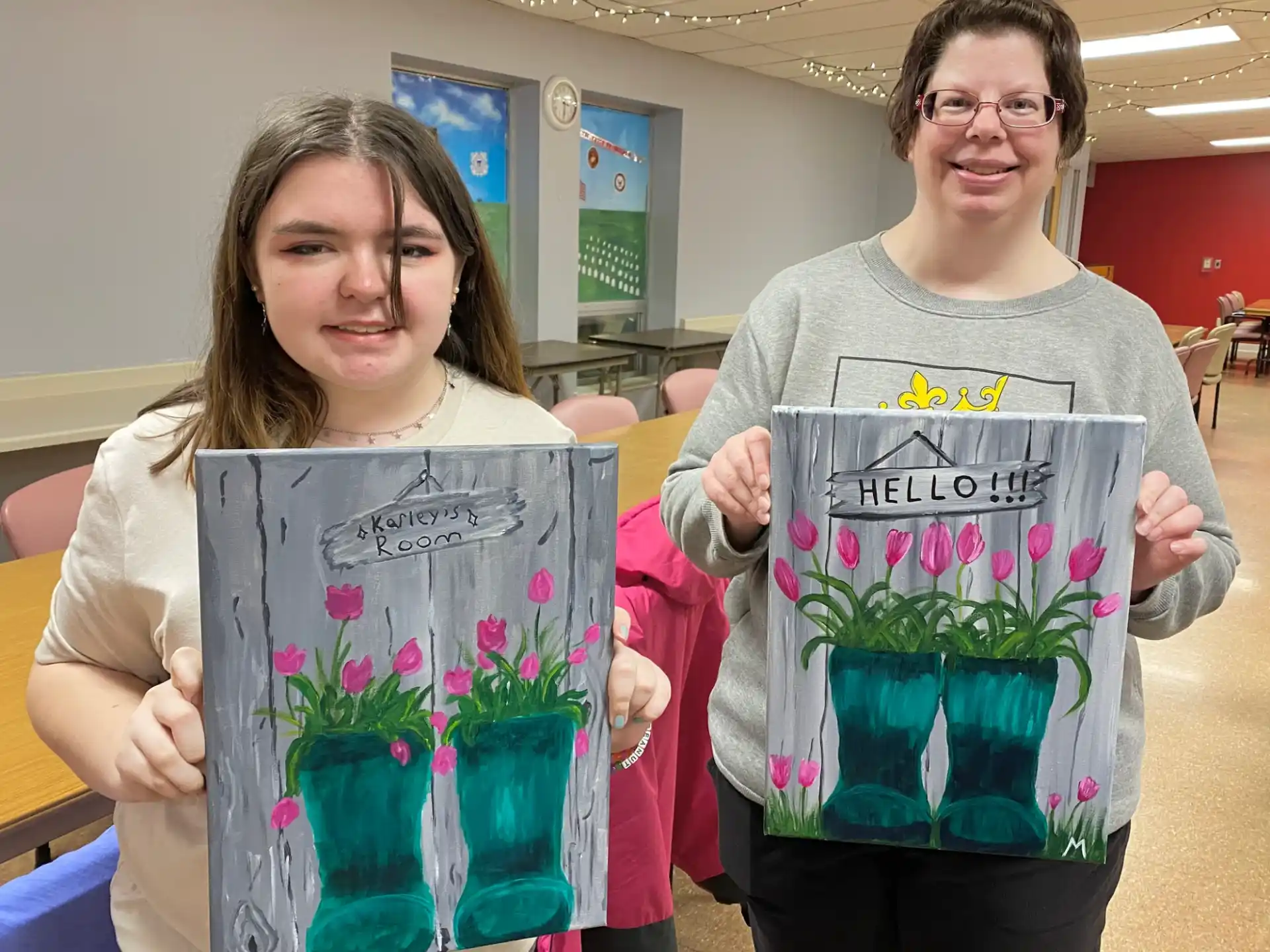 a couple of women holding flowers