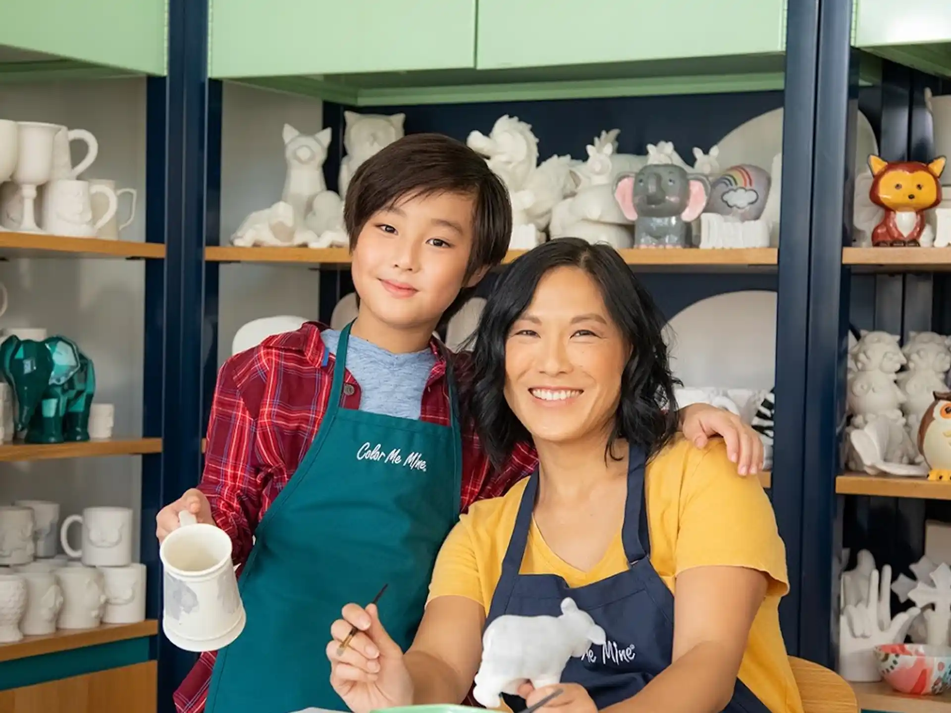 a woman and a boy posing for a picture