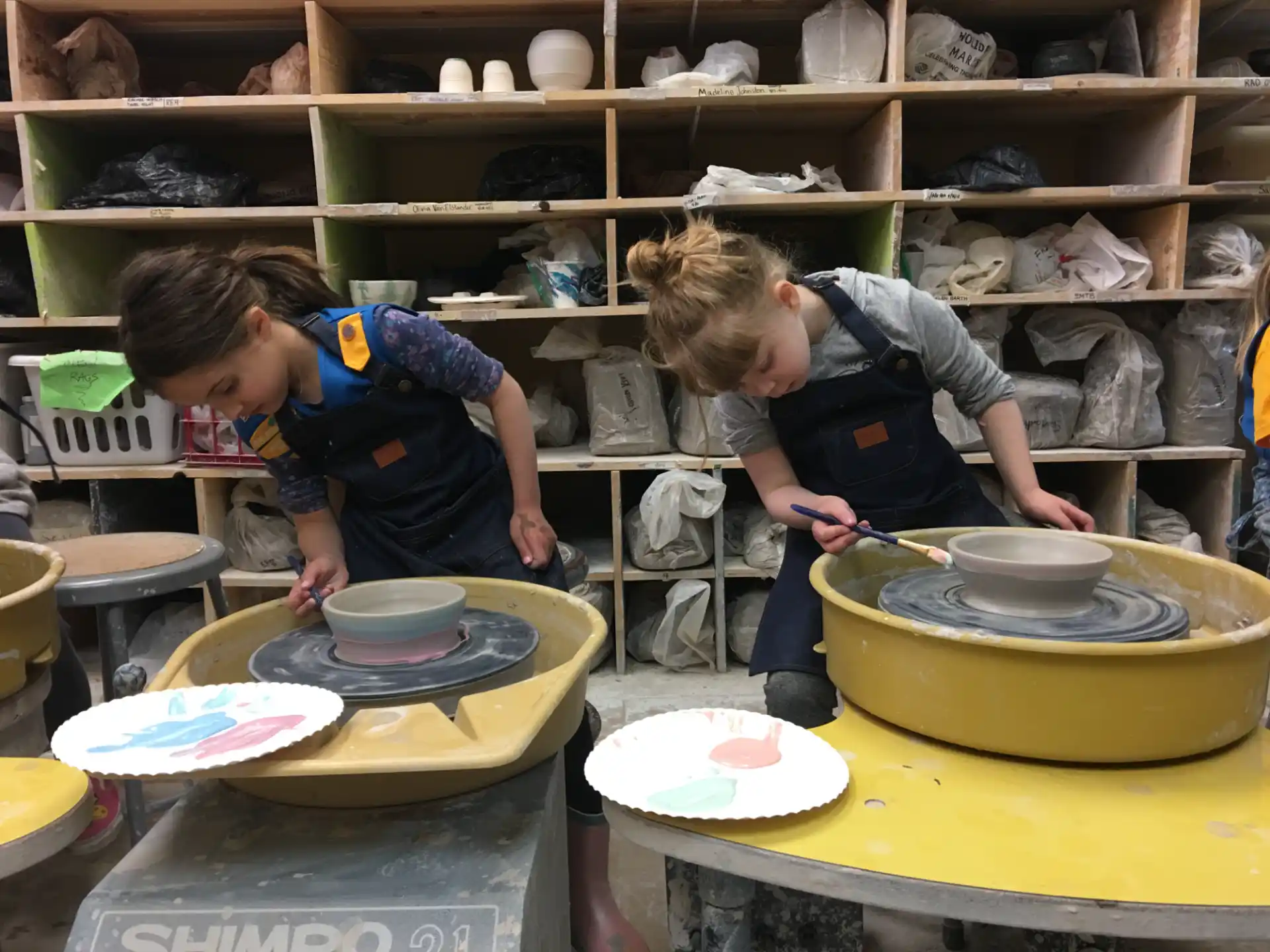 kids making clay pots