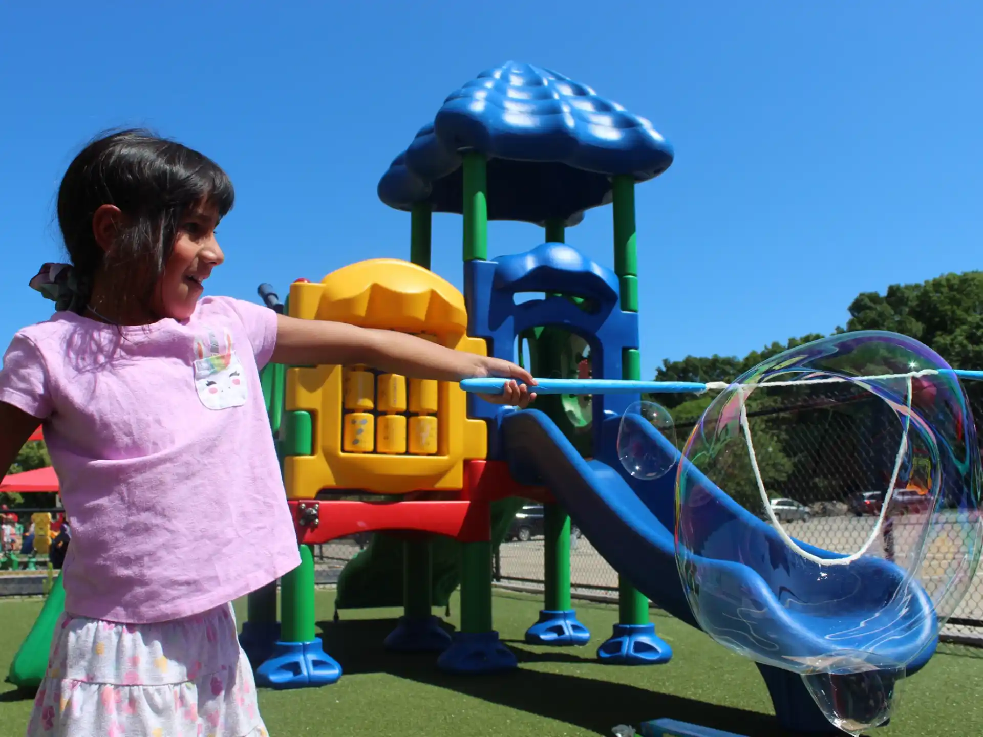 a girl playing with a toy