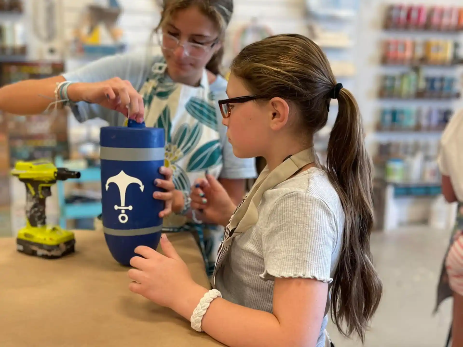 a person and a girl at a store