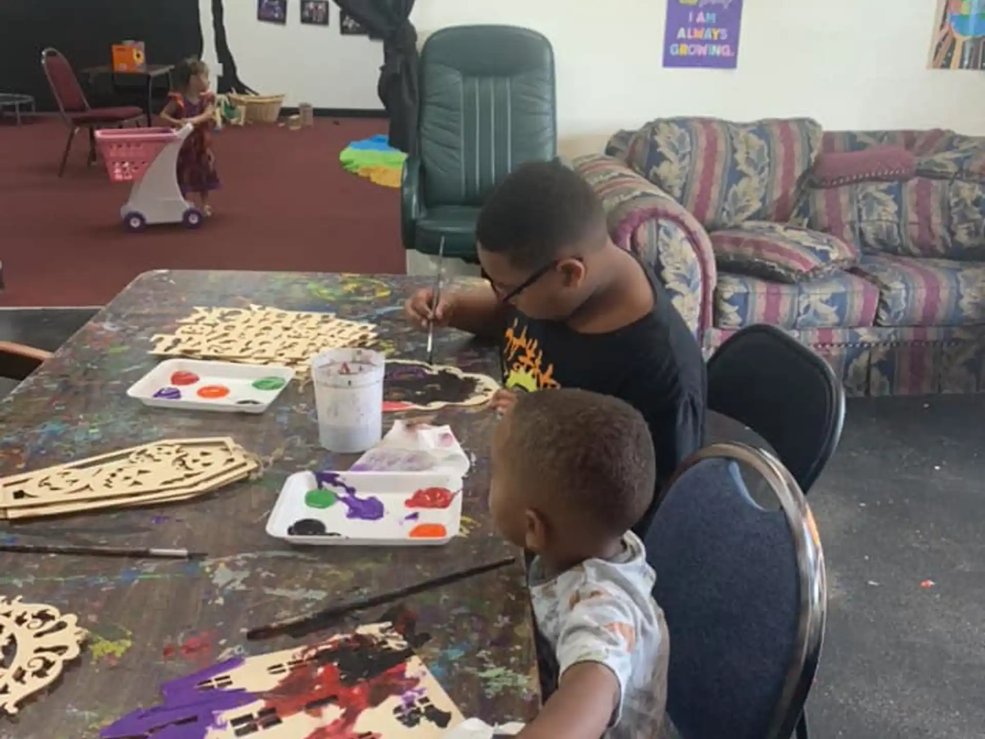 a person and a child playing a board game