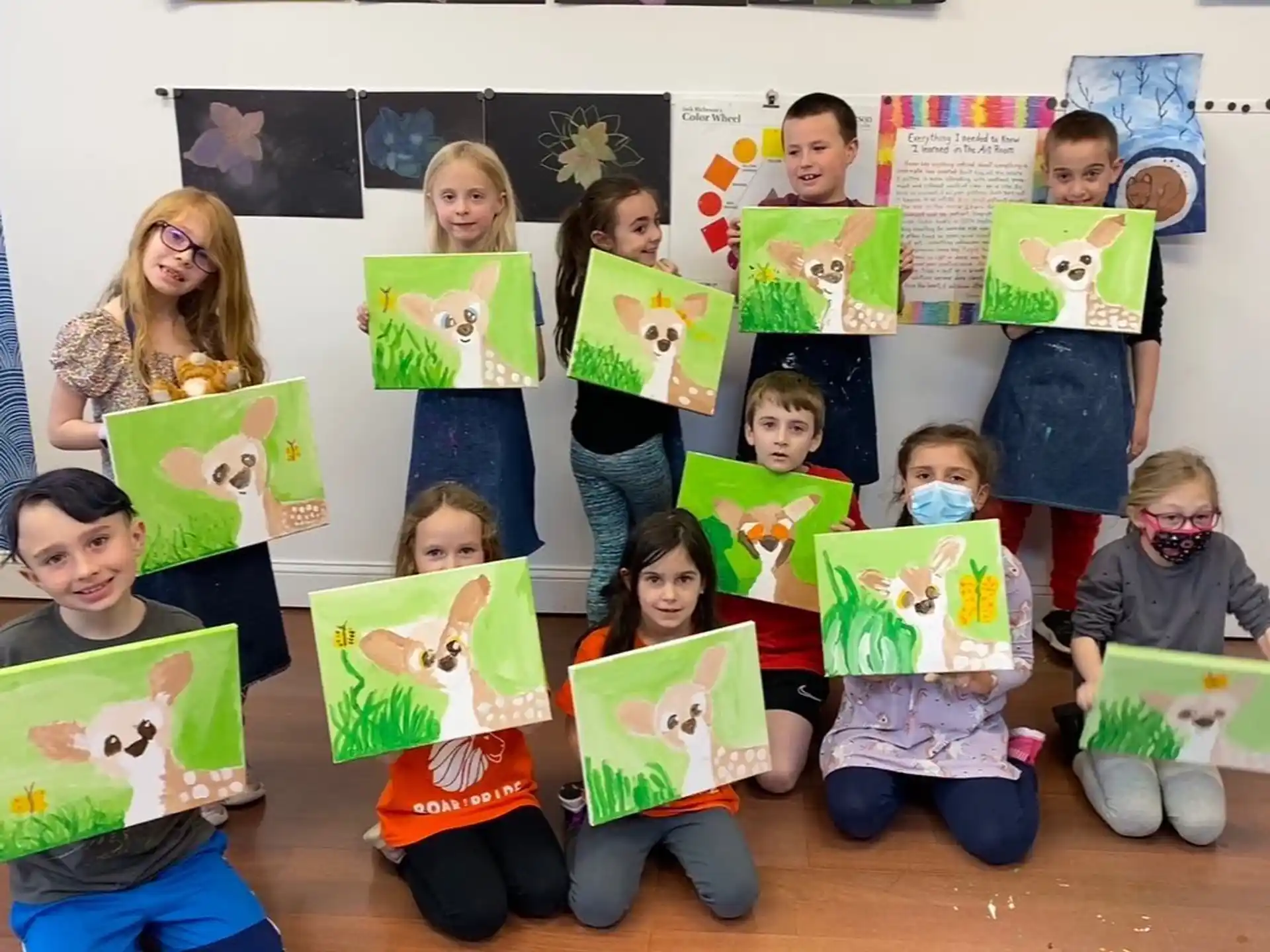 a group of children holding books