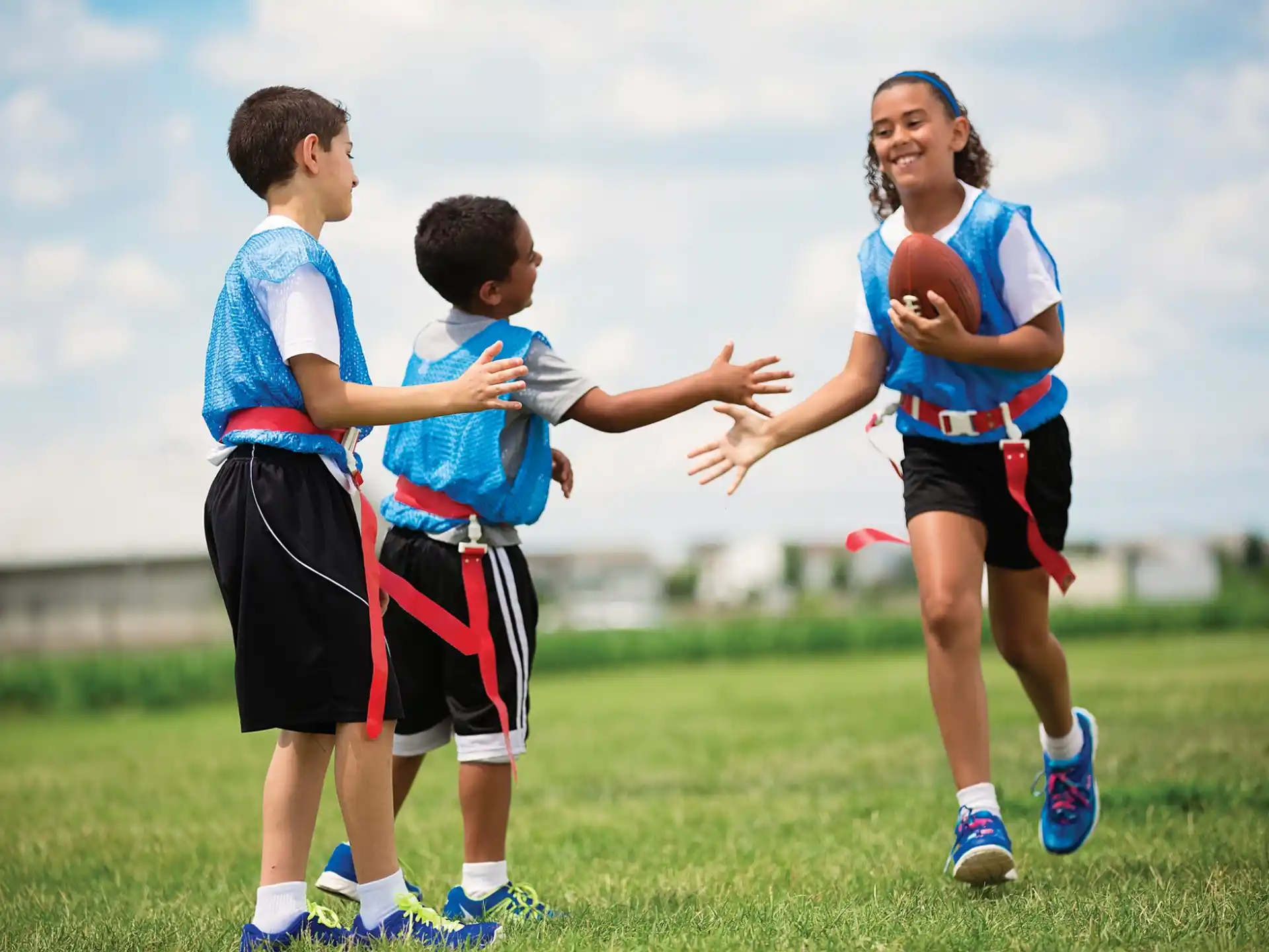 a group of people playing with a ball