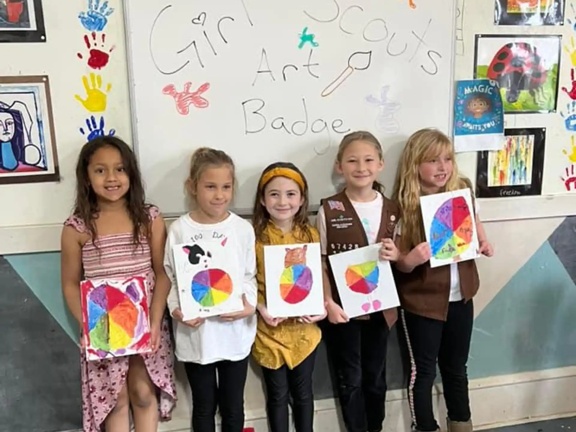 a group of children holding up a sign in a classroom
