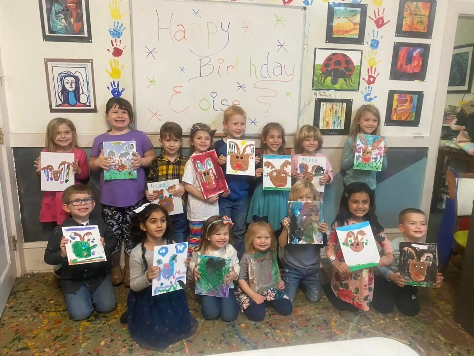 a group of children holding up books