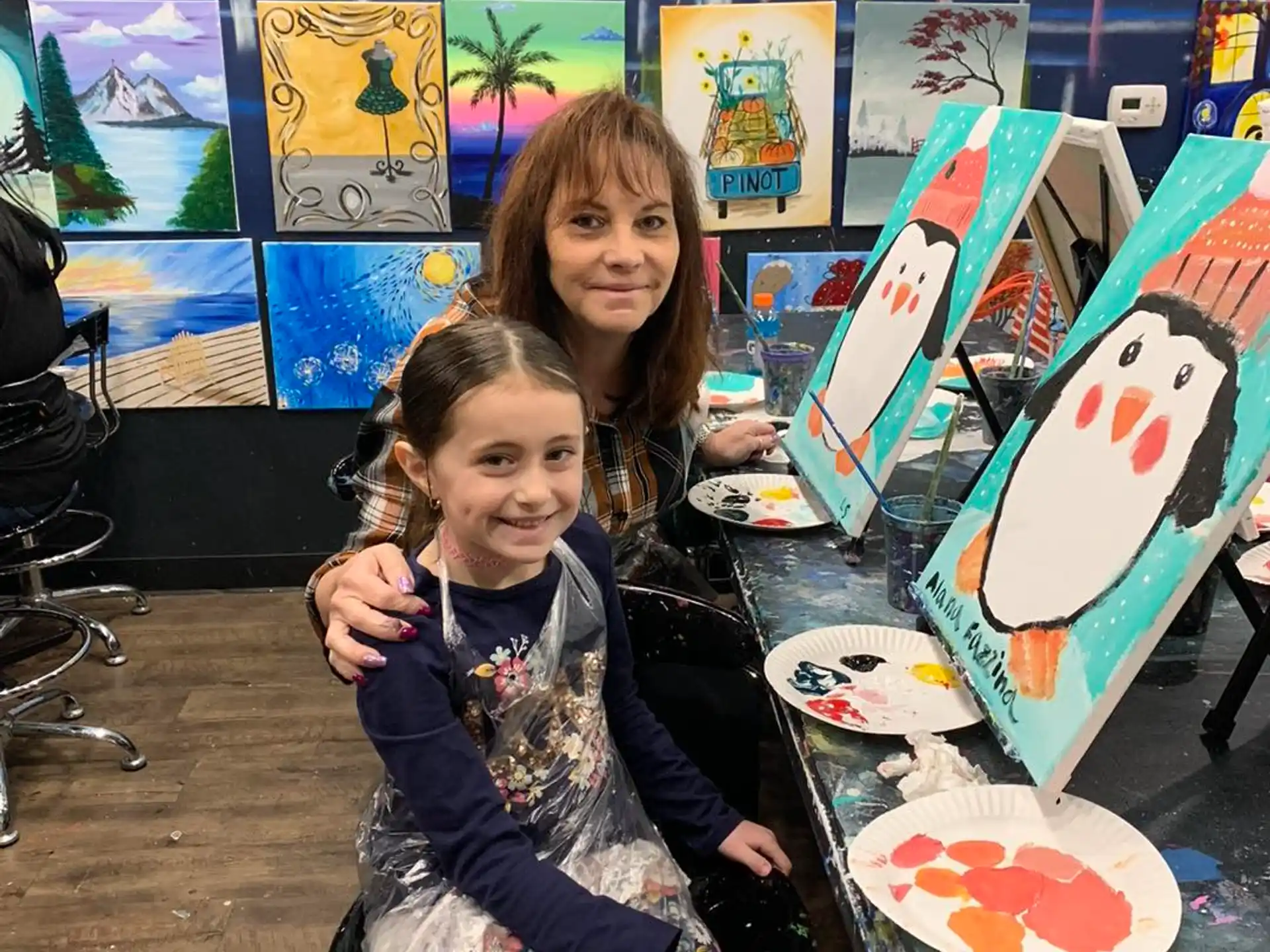 a person and a girl posing with surfboards