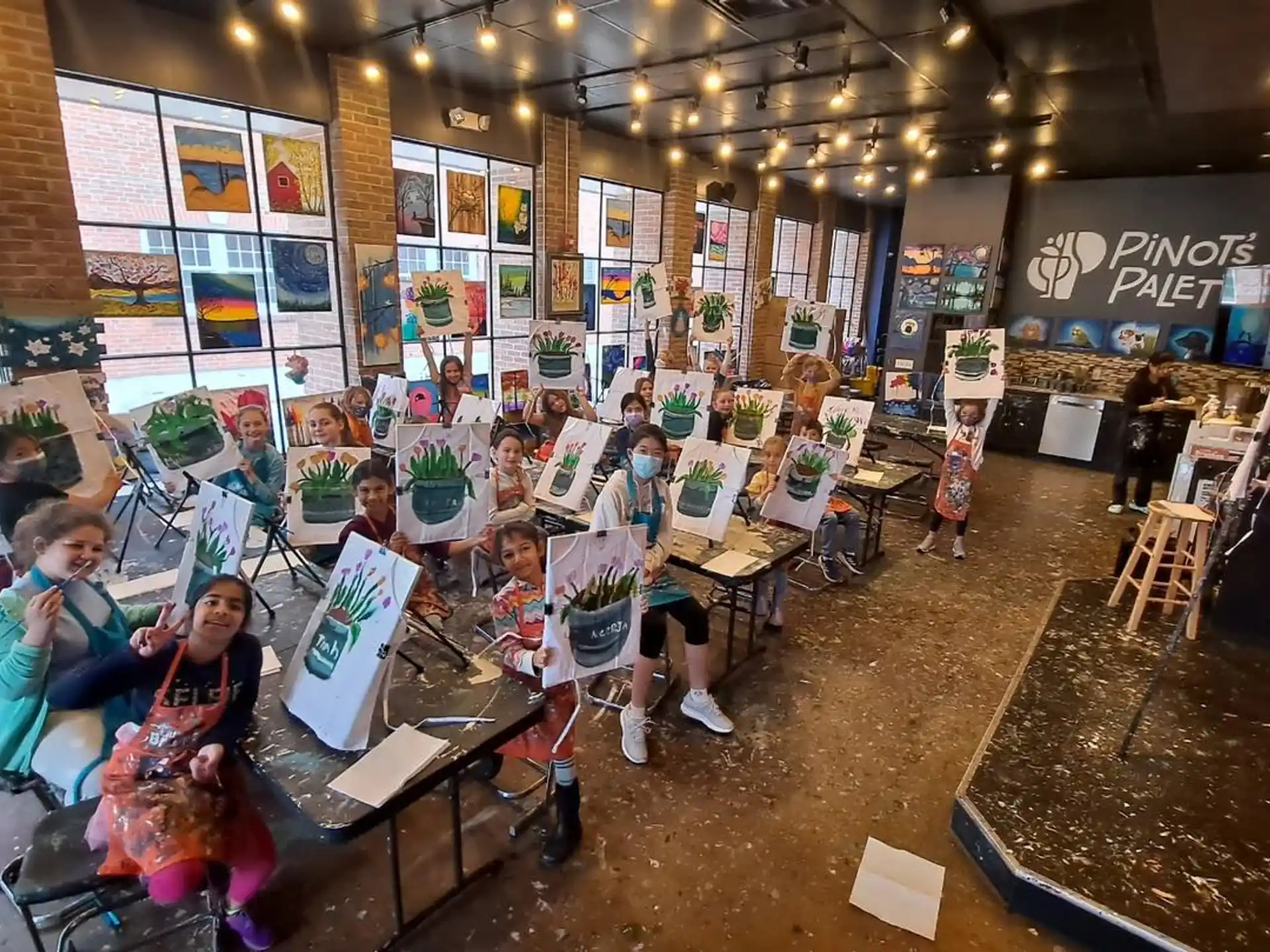 a group of children sitting at tables