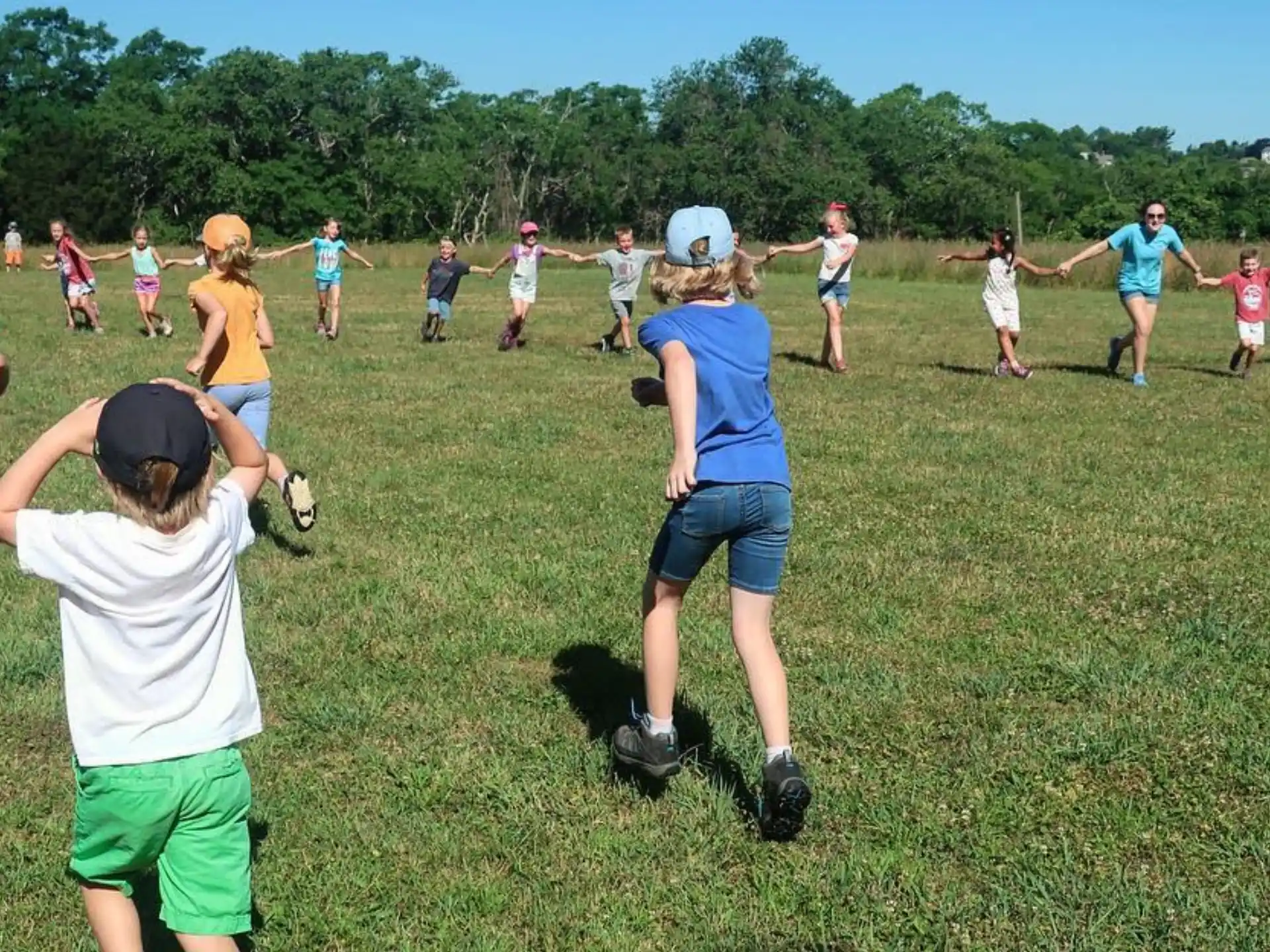 a group of people playing in a field