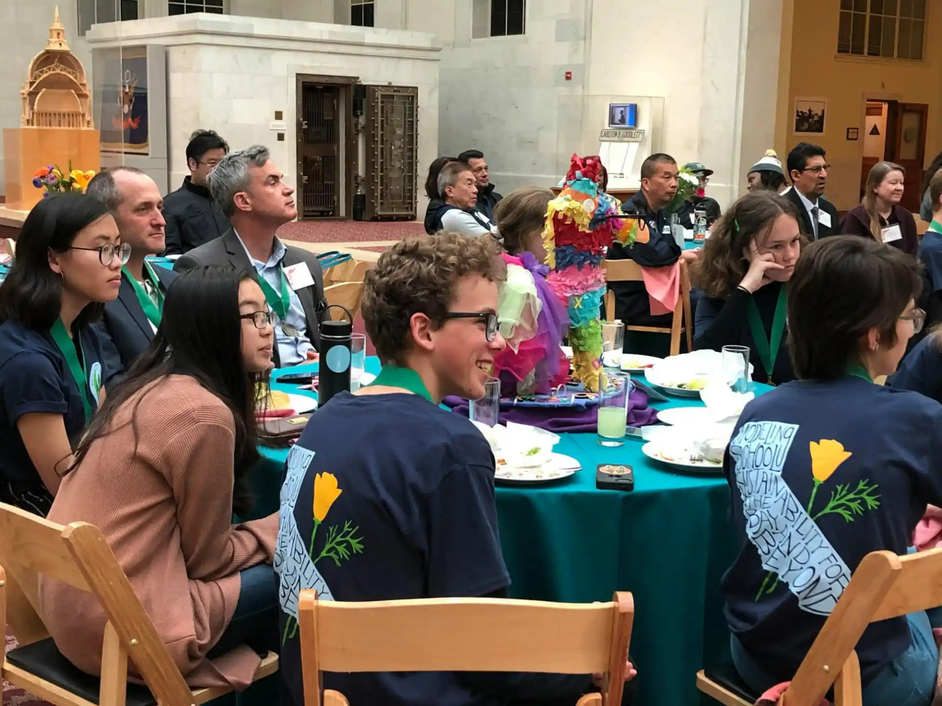 a group of people sitting at tables