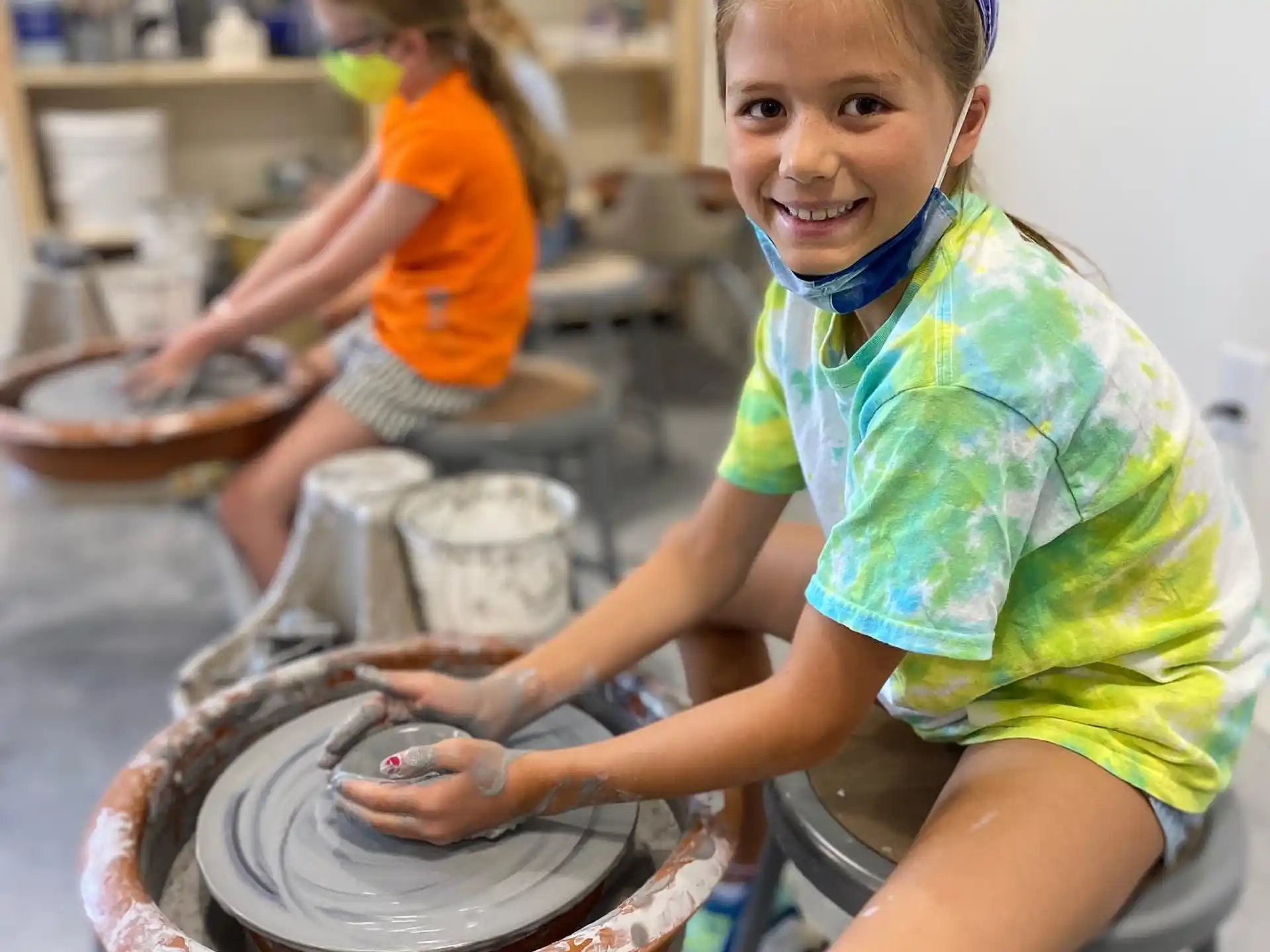 a young girl working on a machine