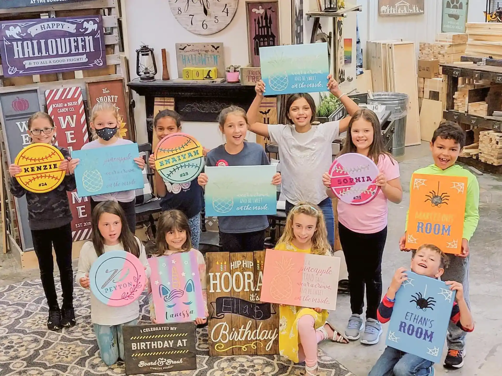a group of children holding signs
