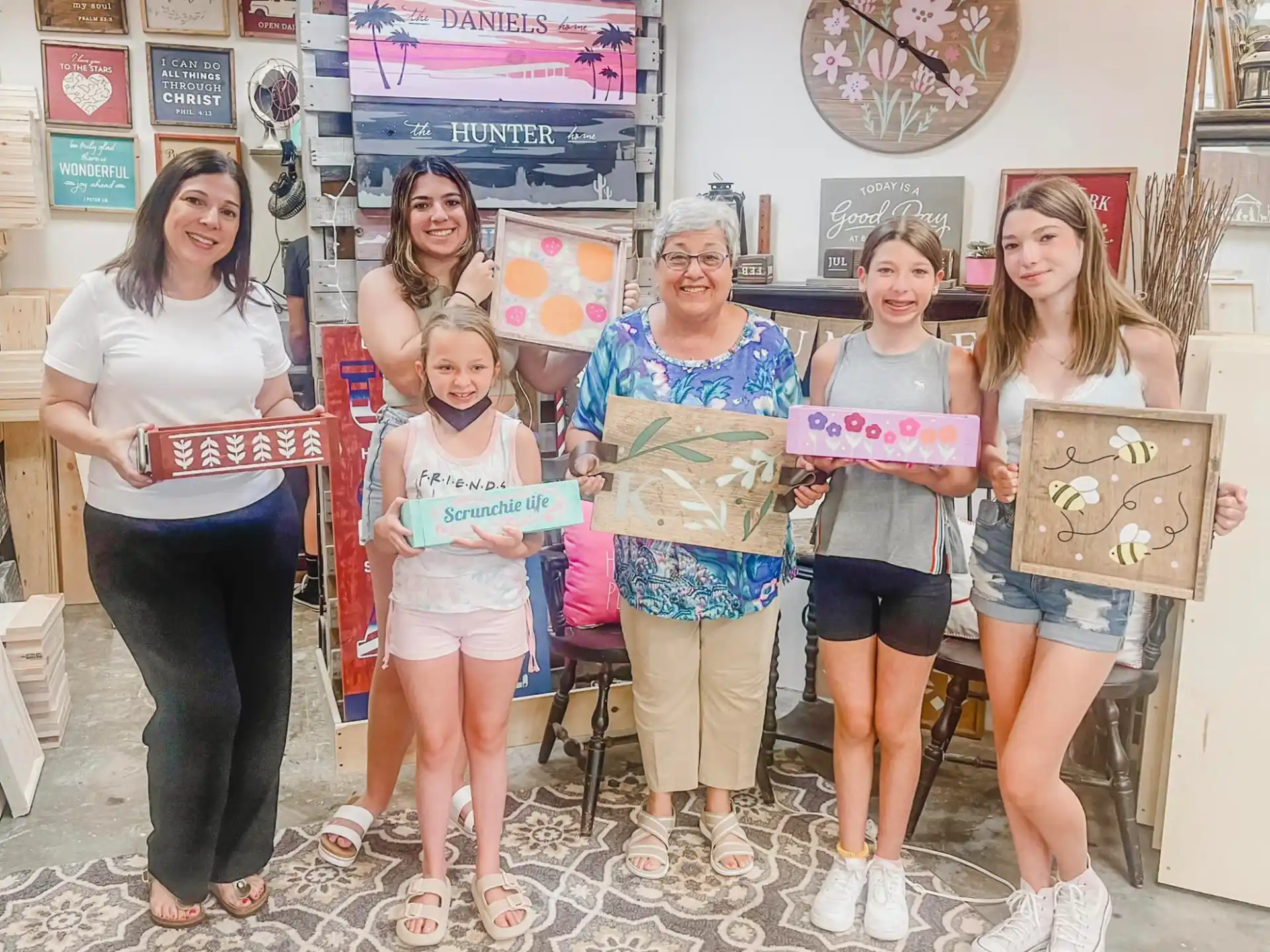 a group of women holding boxes