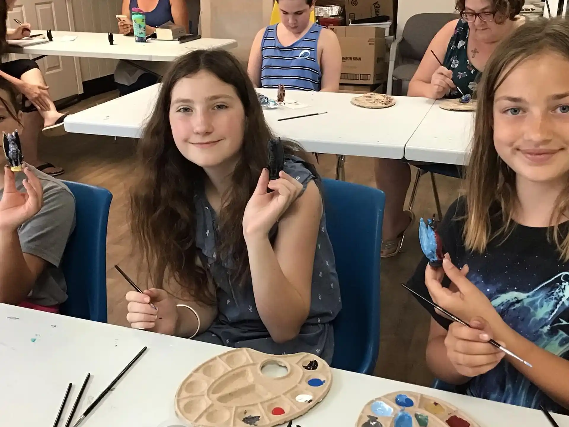 a group of girls sitting at a table