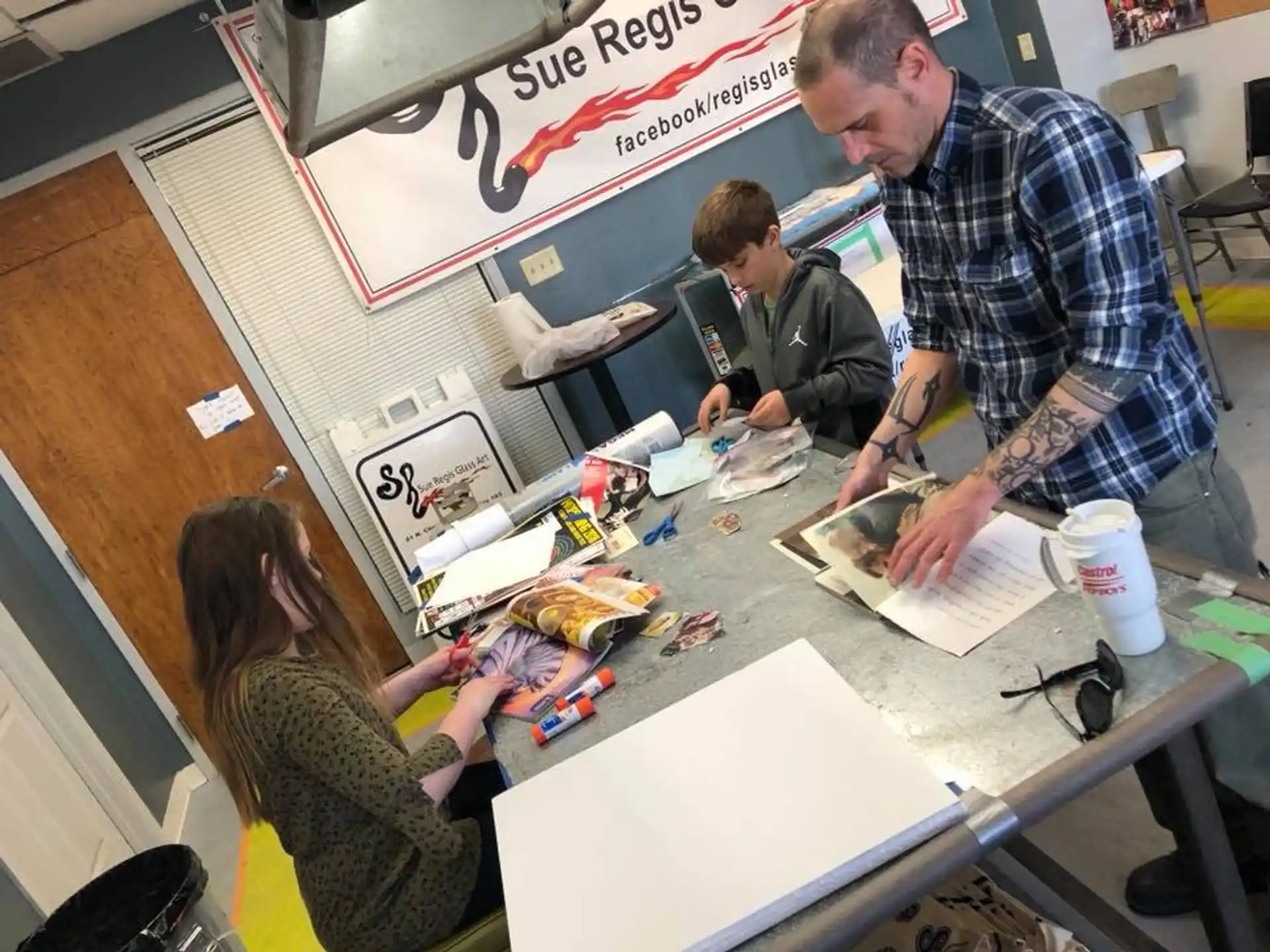 a group of people working at a table