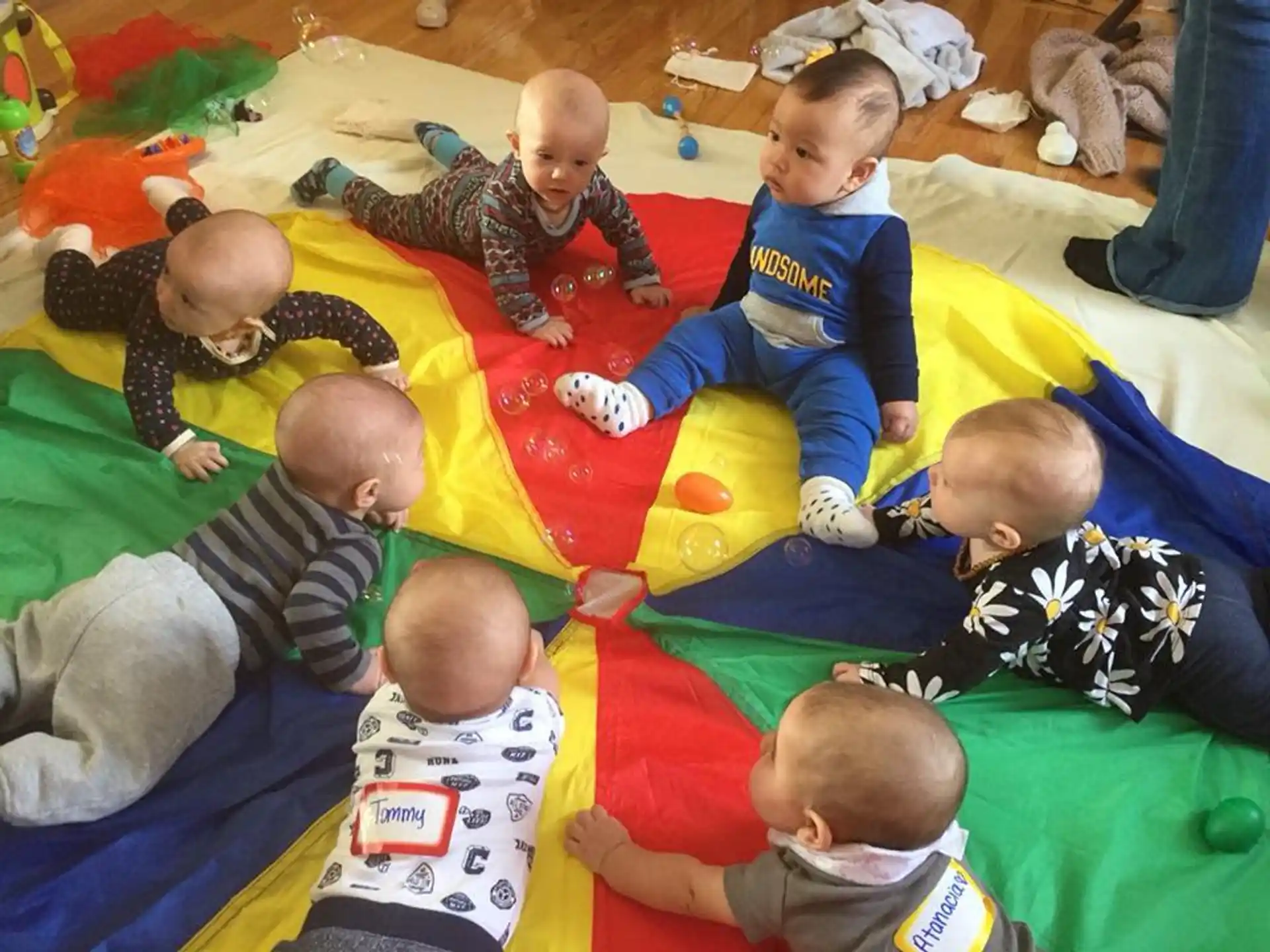 a group of babies on a blanket