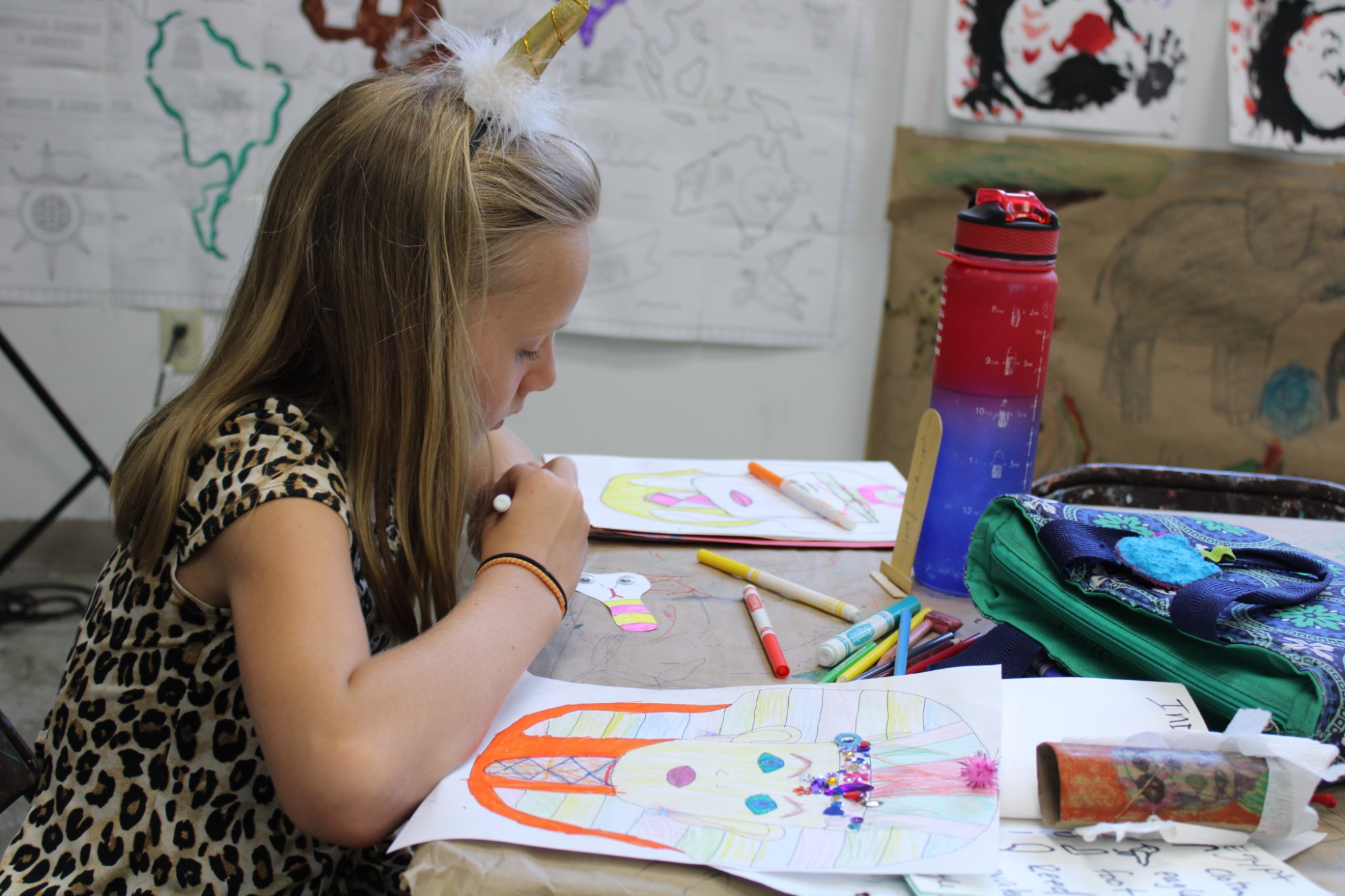 a woman painting on a table